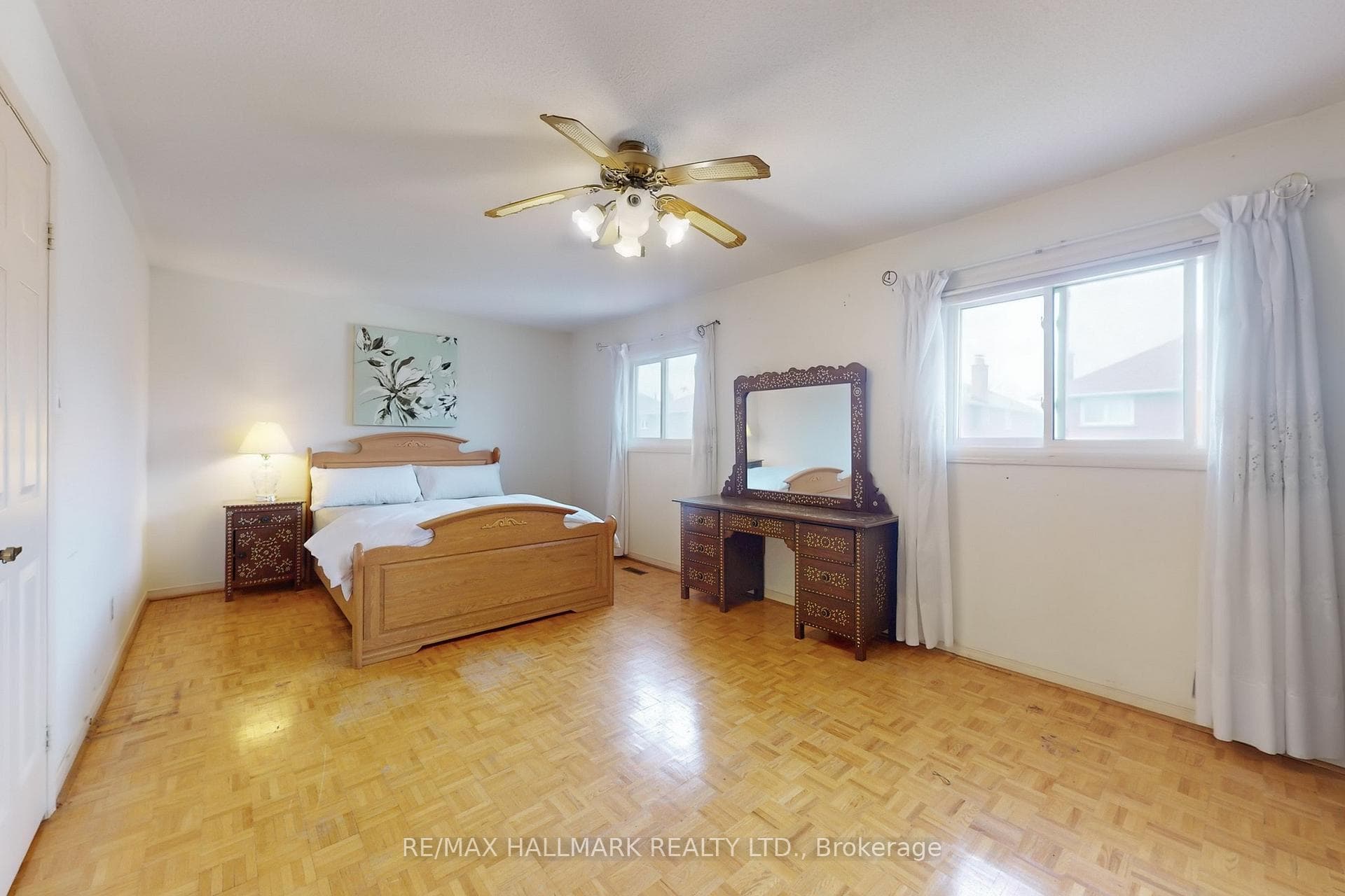 Primary Bedroom with 2 sunfilled windows