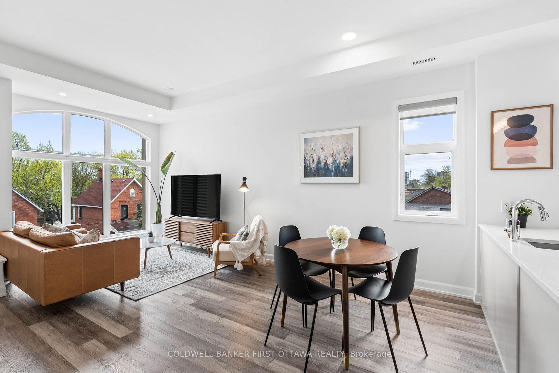 Elegant dining room space w/ bright window.