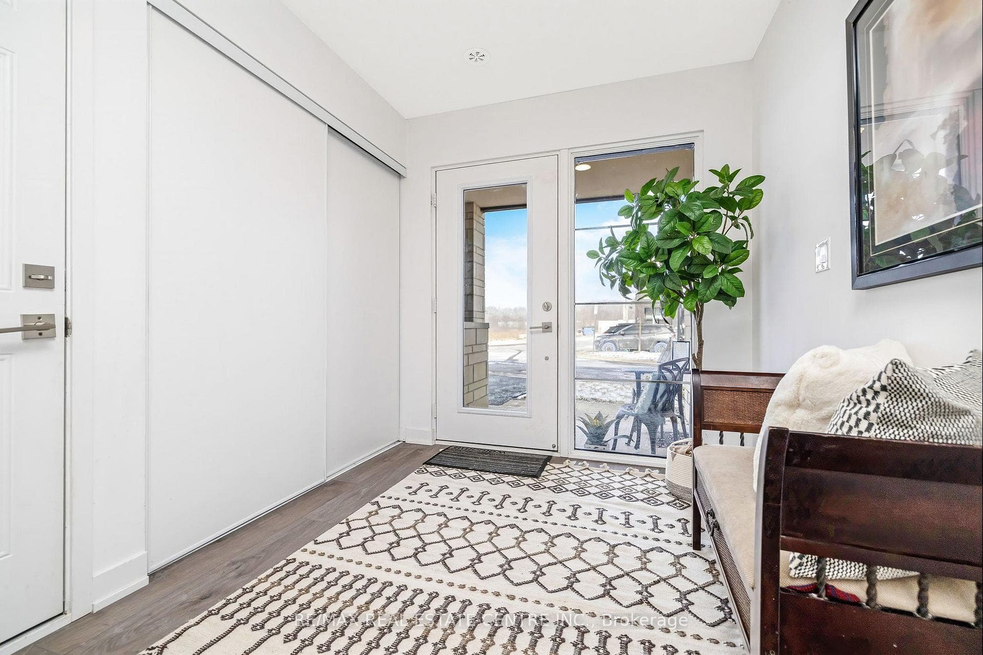 Spacious front entryway with double coat closet