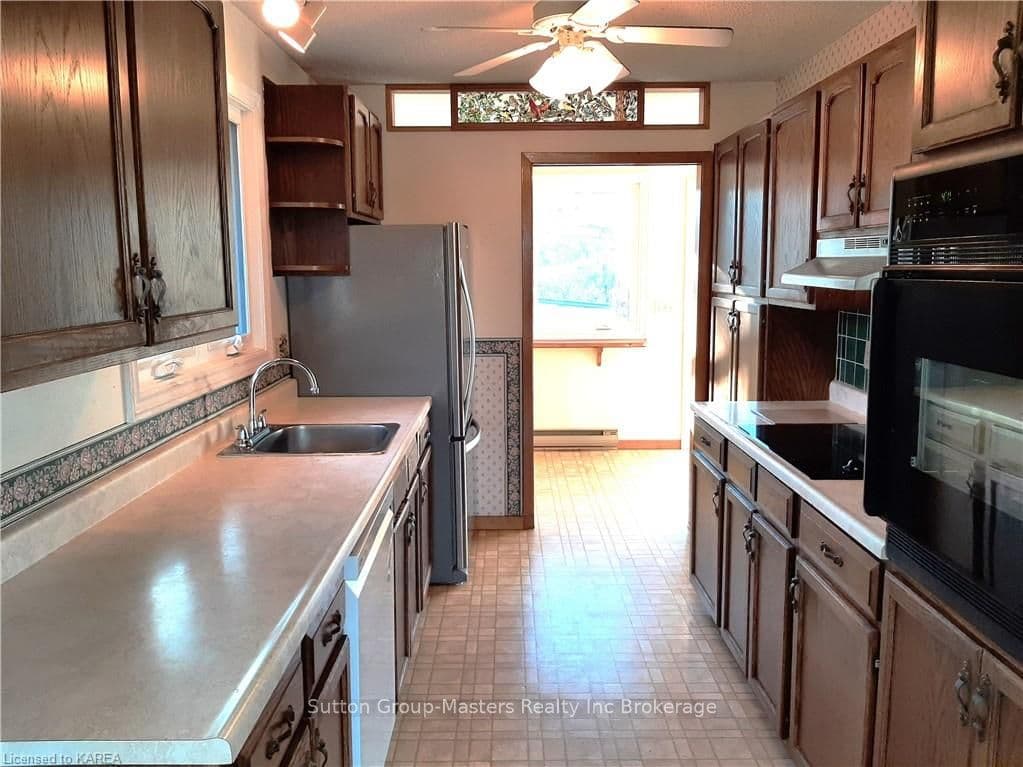 Kitchen and View of Foyer