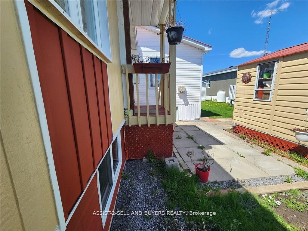 A small side patio space at the side door