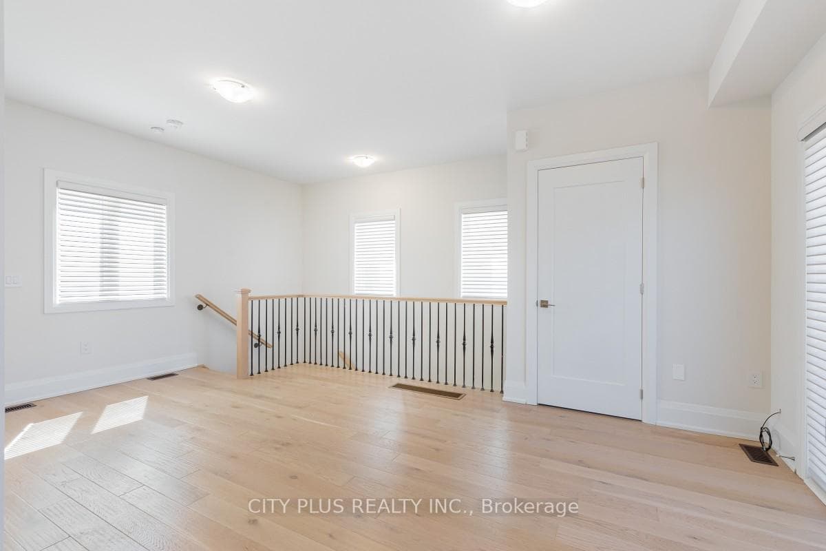 Coach House - Living area w/ ample windows
