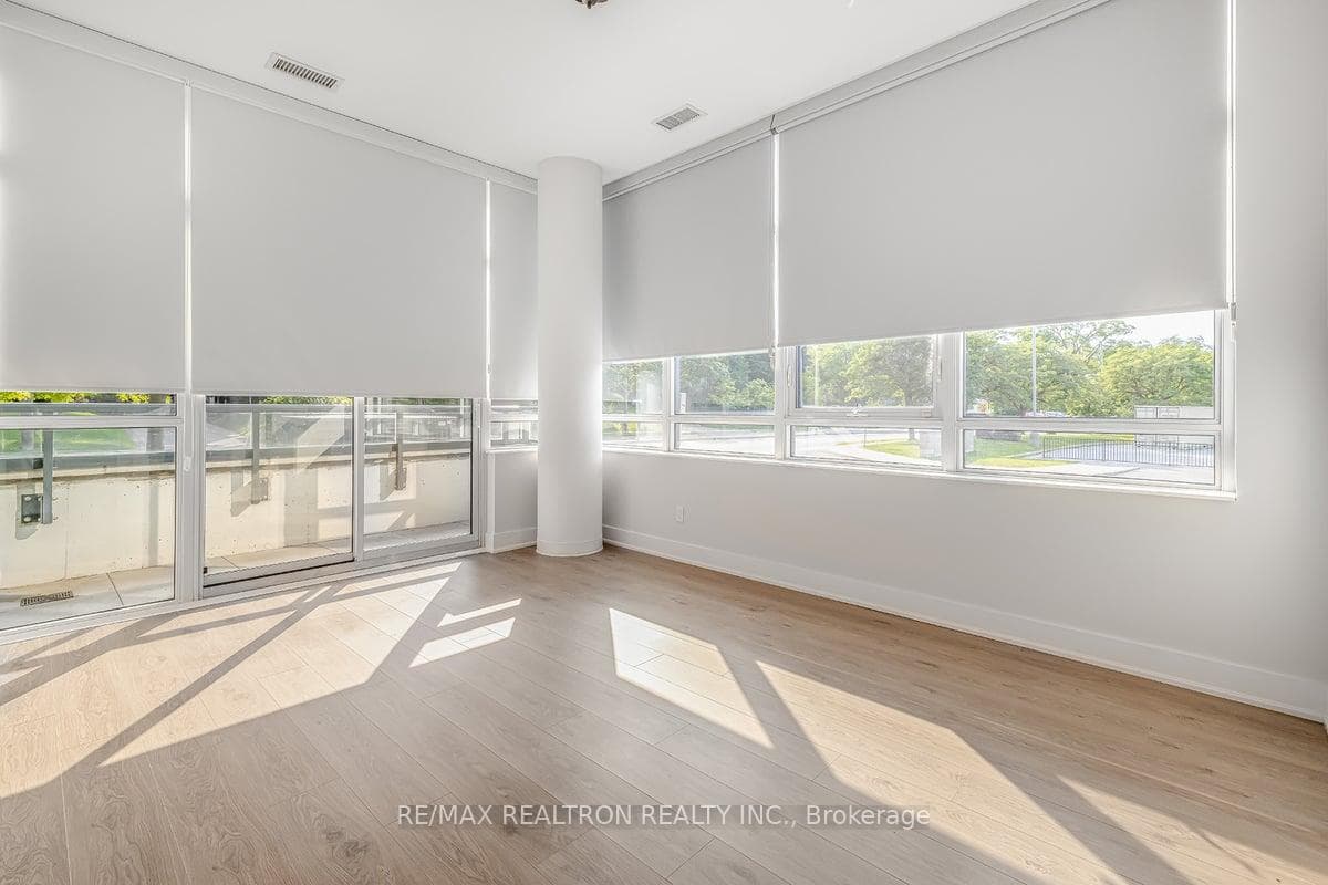 Primary with wall of windows and walkout
