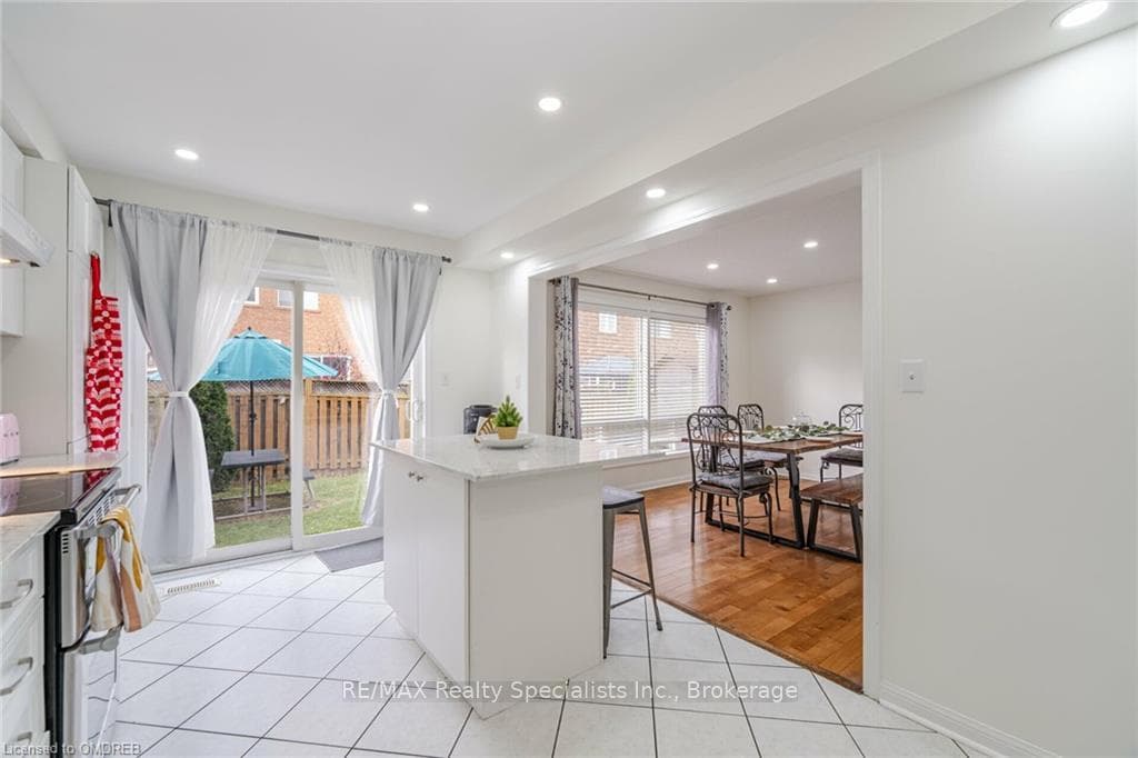 Kitchen featuring a kitchen breakfast bar, electri