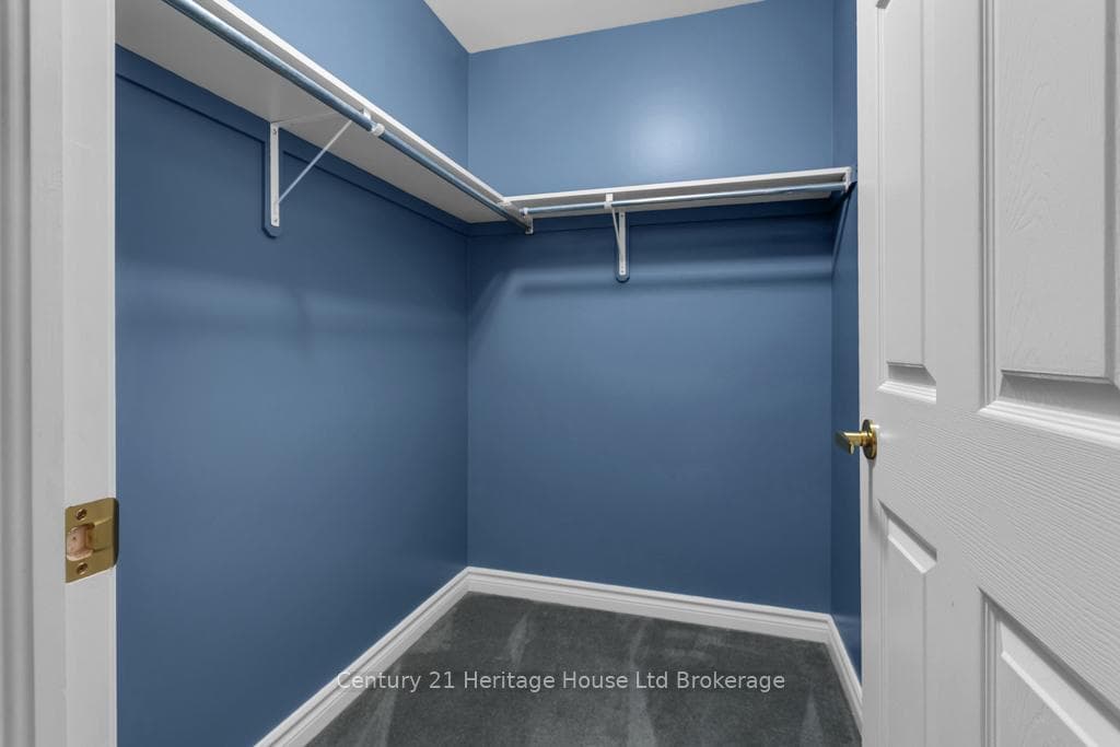 Primary bedroom walk in closet