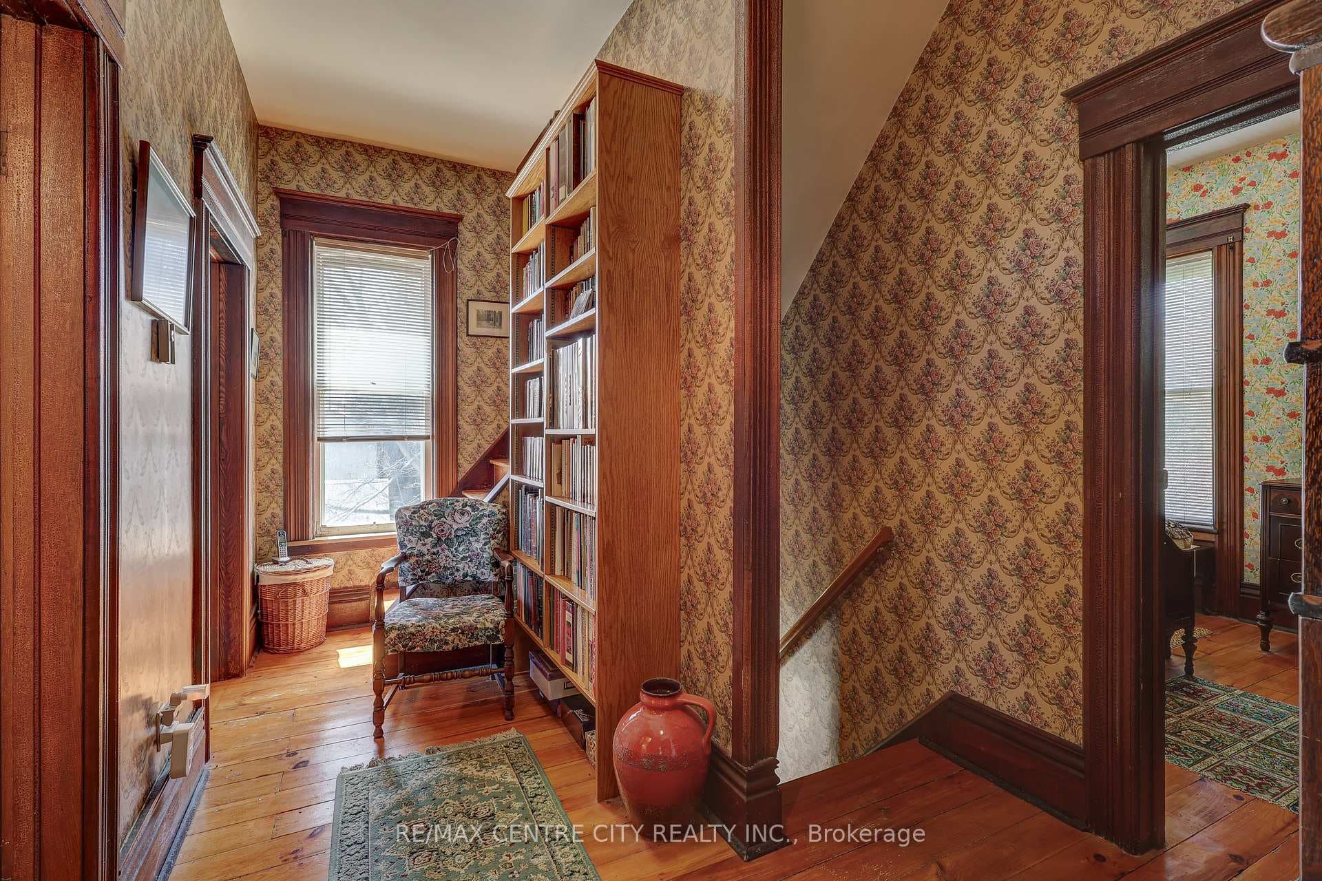 Stairs to kitchen + hallway to bathrooms
