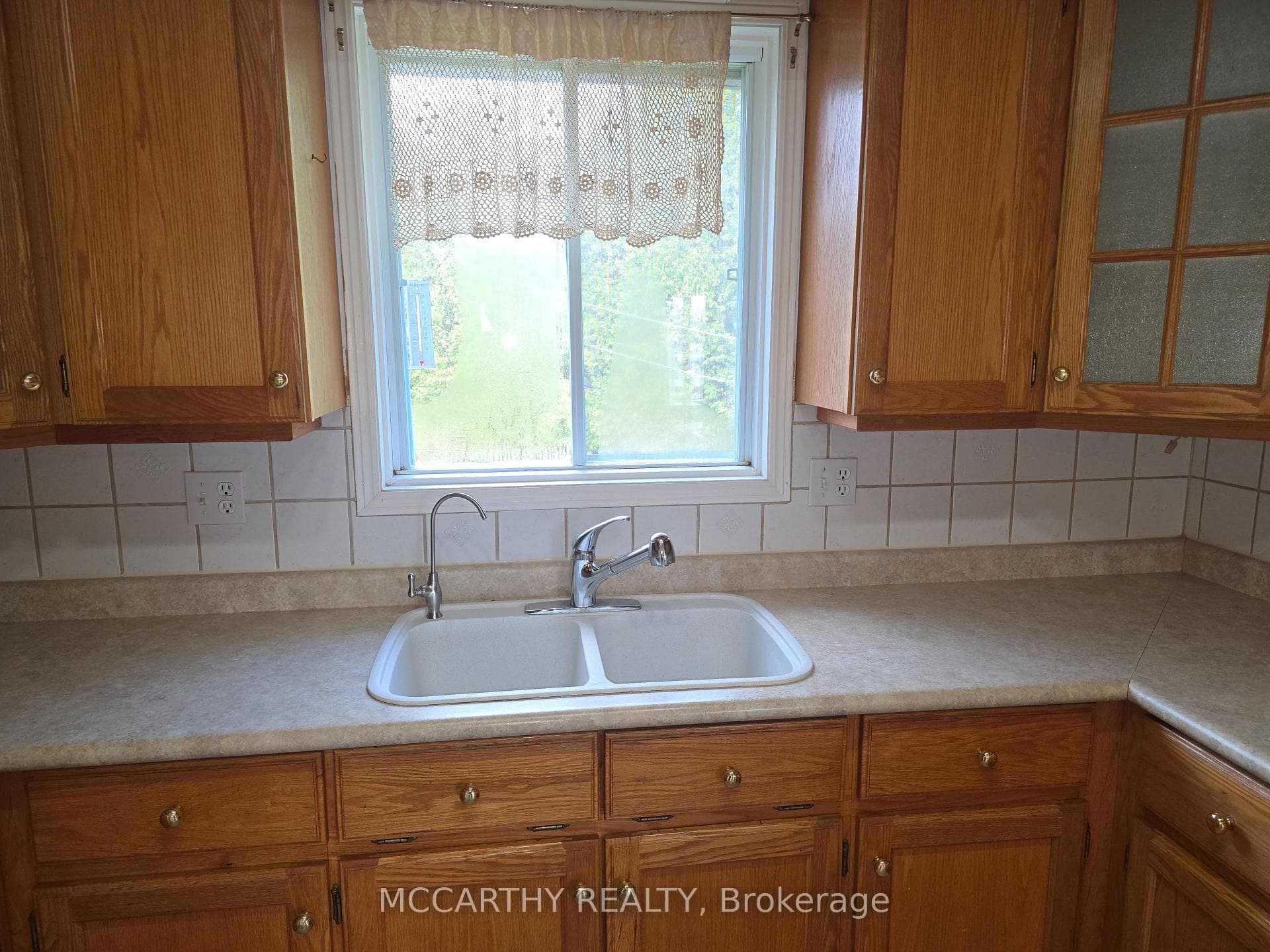 double sink window out over back yard