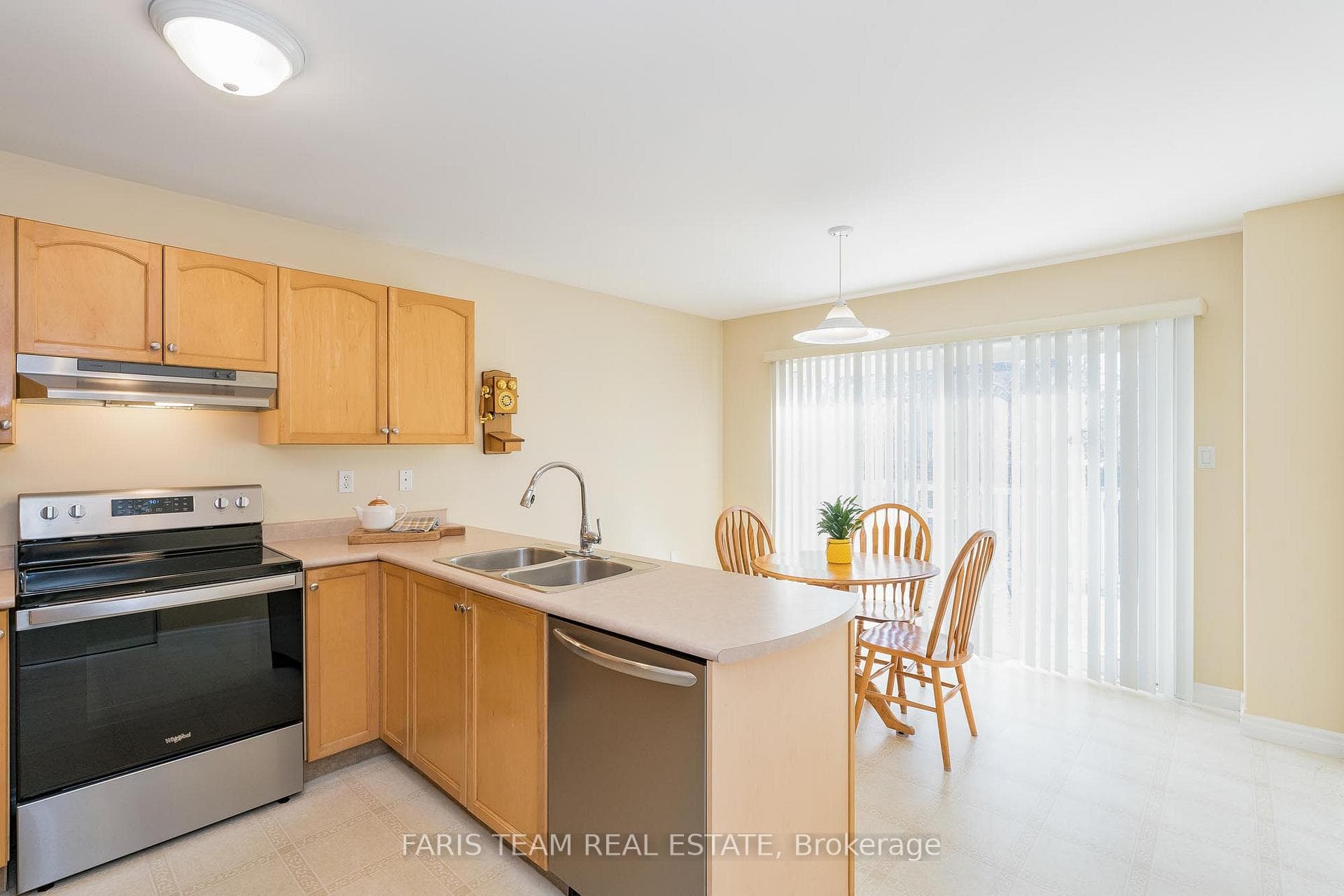 Kitchen with light wood cabinetry