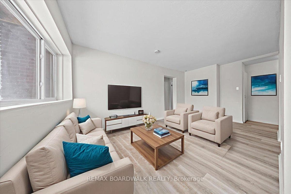 Large living rm provides multiple seating options