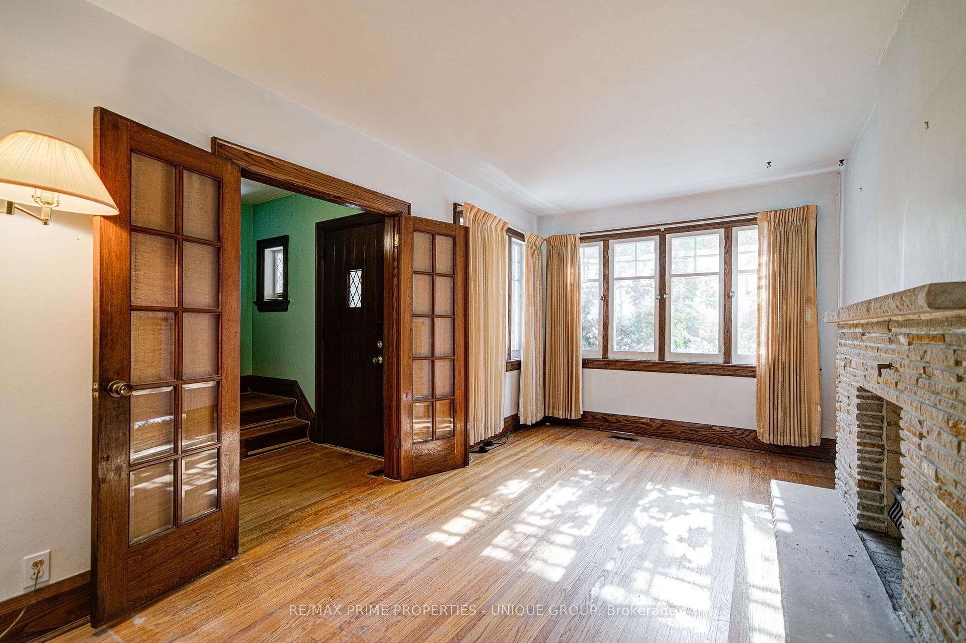 Living room with french doors to front foyer.