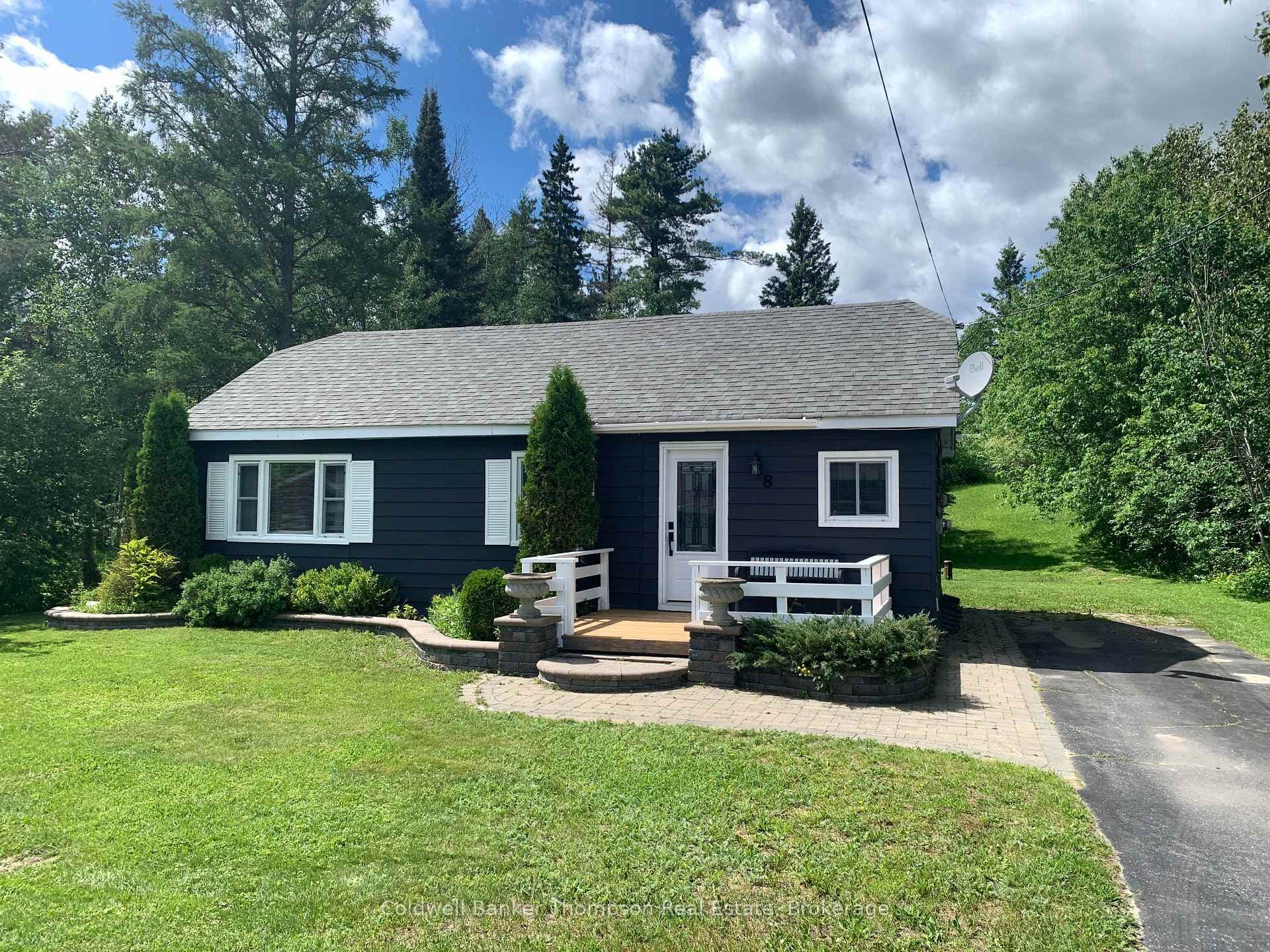 Front of House with Paved Driveway