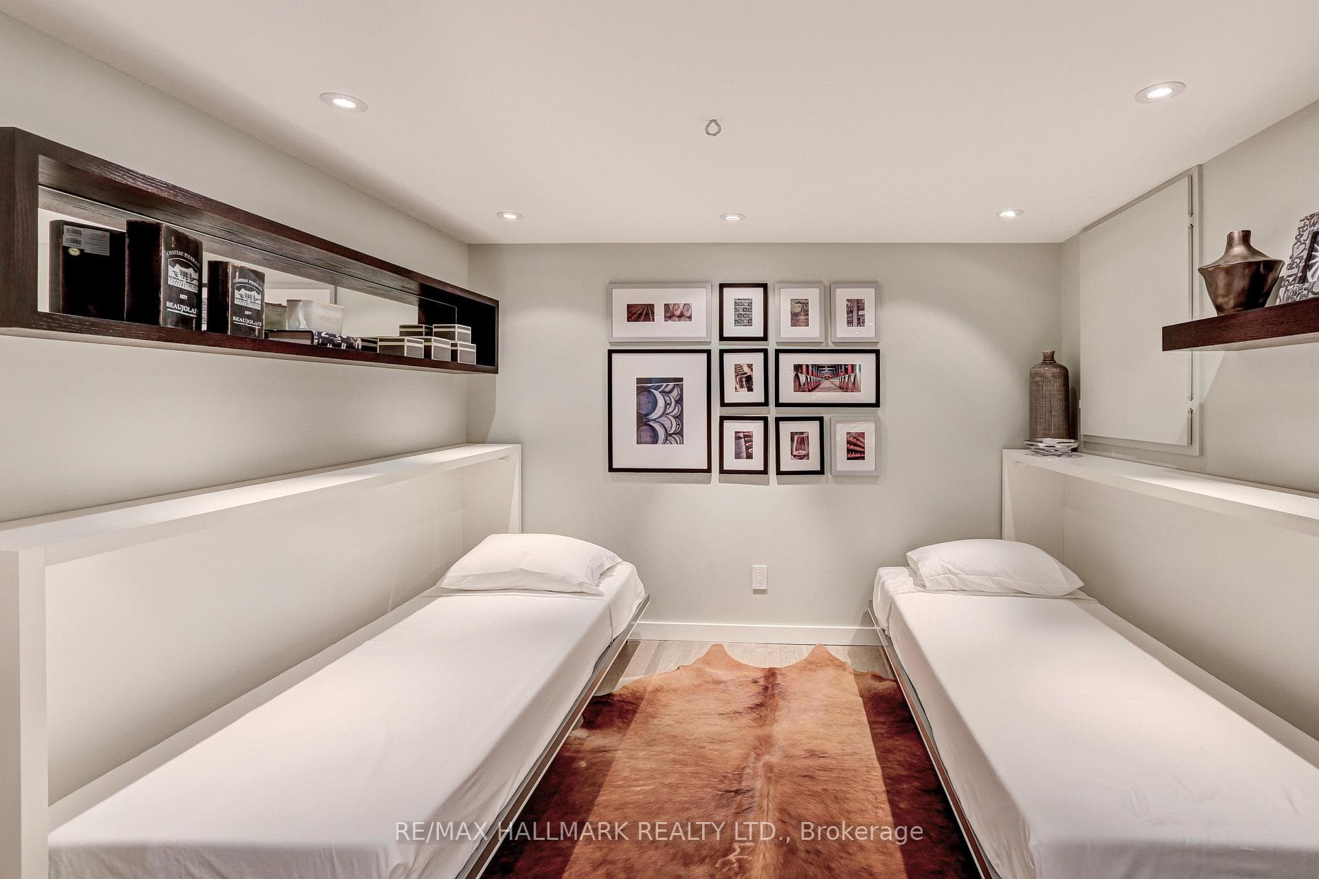 Basement bedroom with remote-controlled divider.