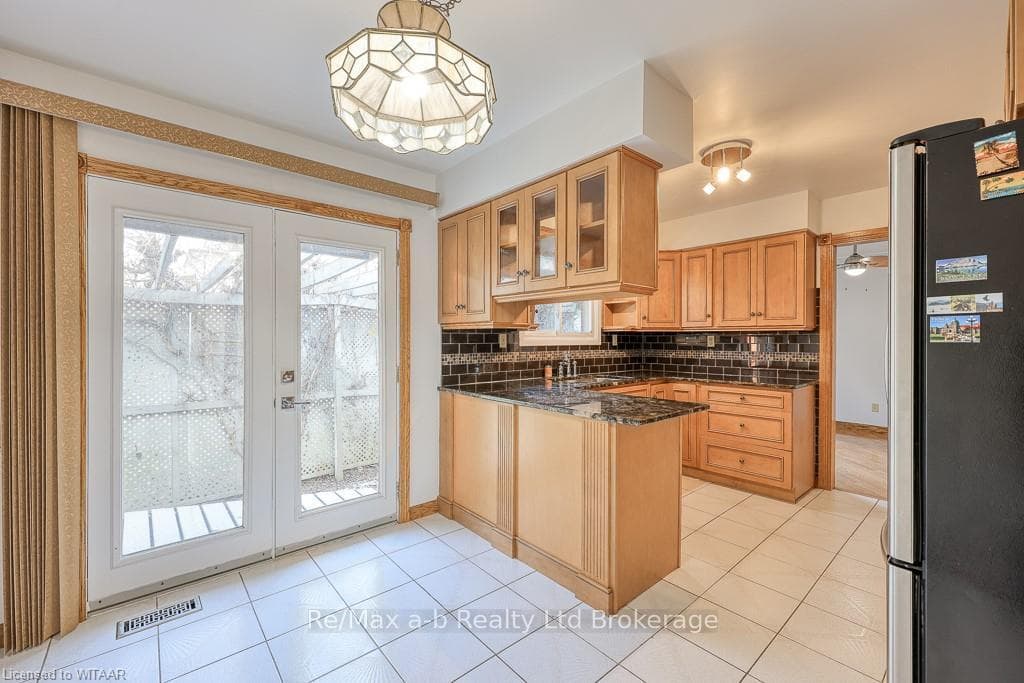 Kitchen with decorative backsplash, stainless stee