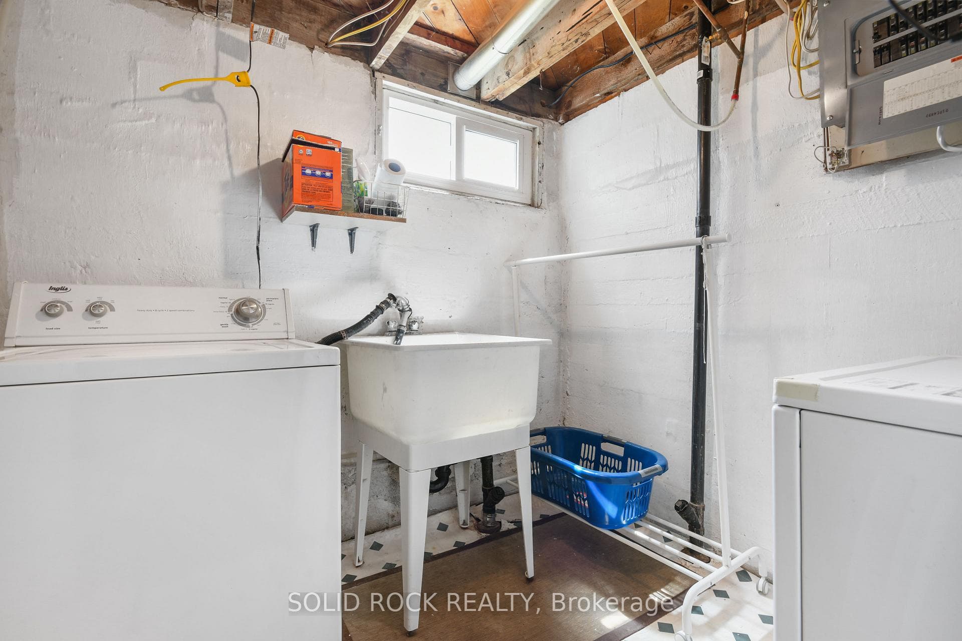 Separate laundry room in basement