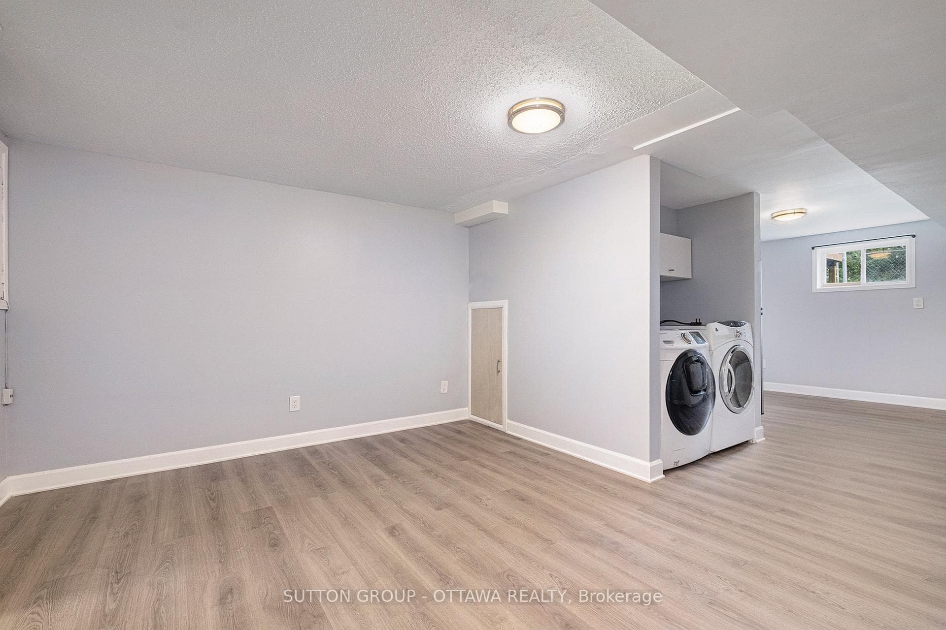 Basement Apartment Living/Laundry Area