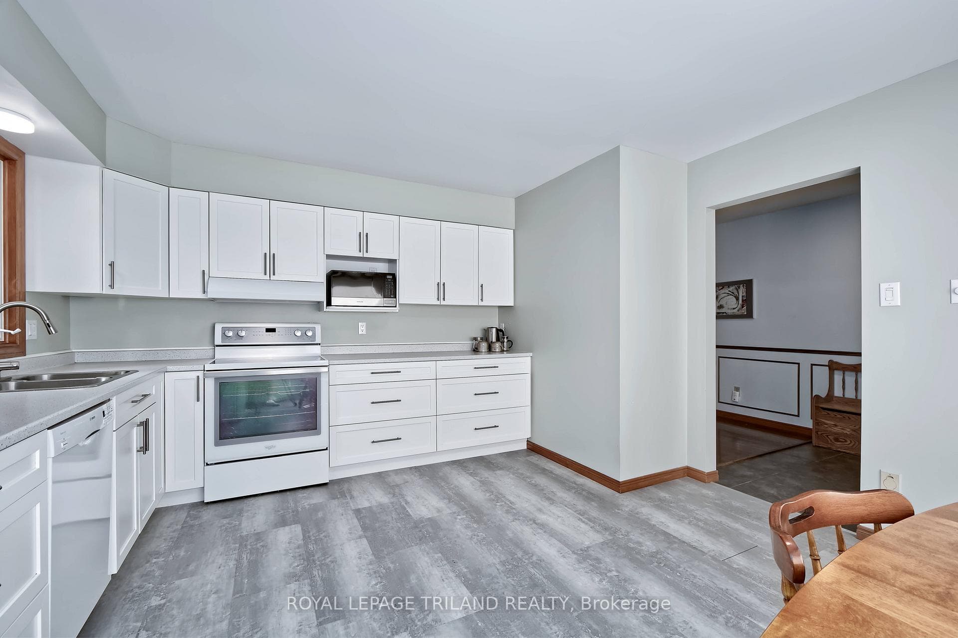 a spacious sun-filled kitchen awaits