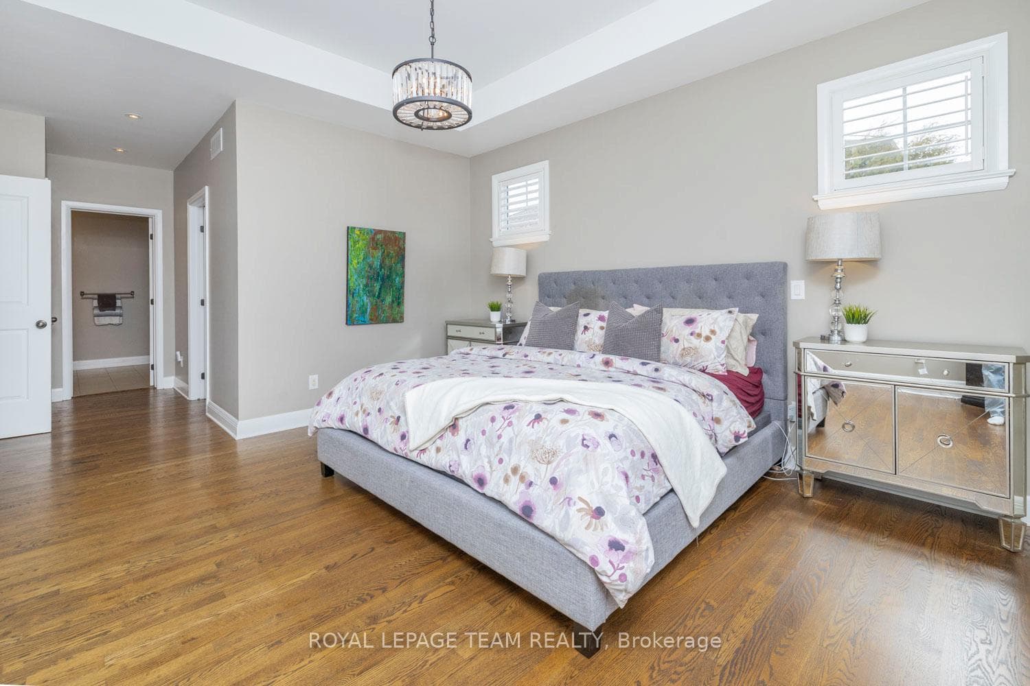 Spacious primary suite with hardwood & walk-in.