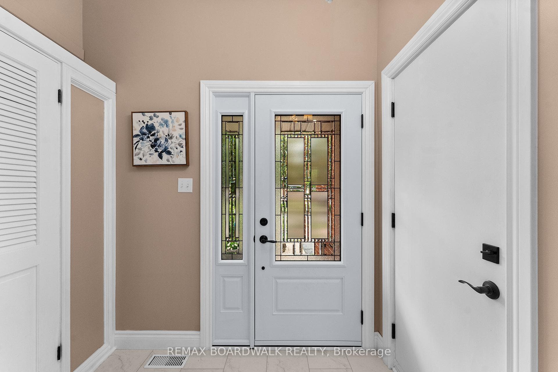 Beautiful entry door and door to garage