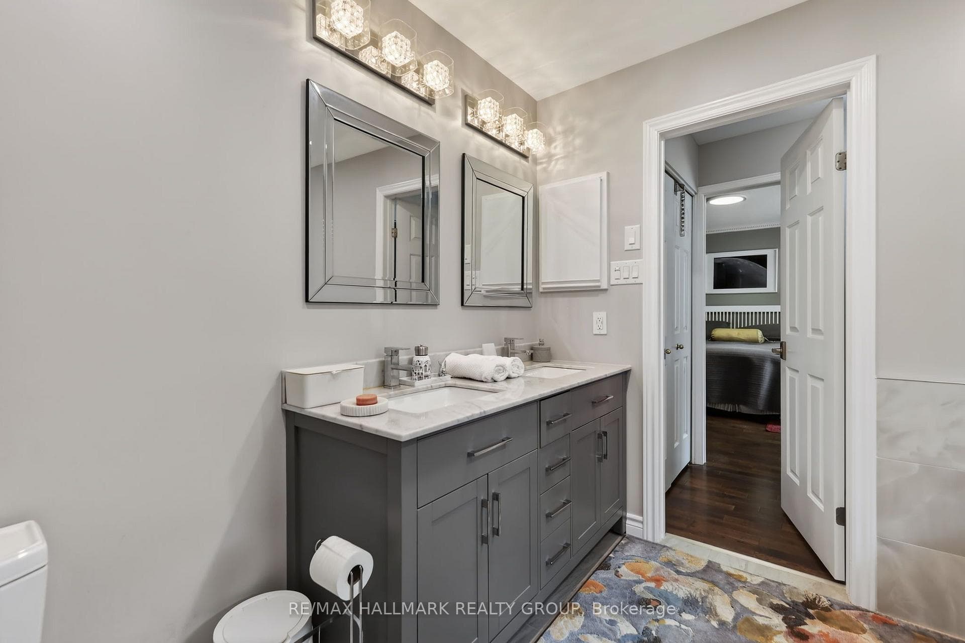 WELL LIT VANITY WITH DOUBLE SINK