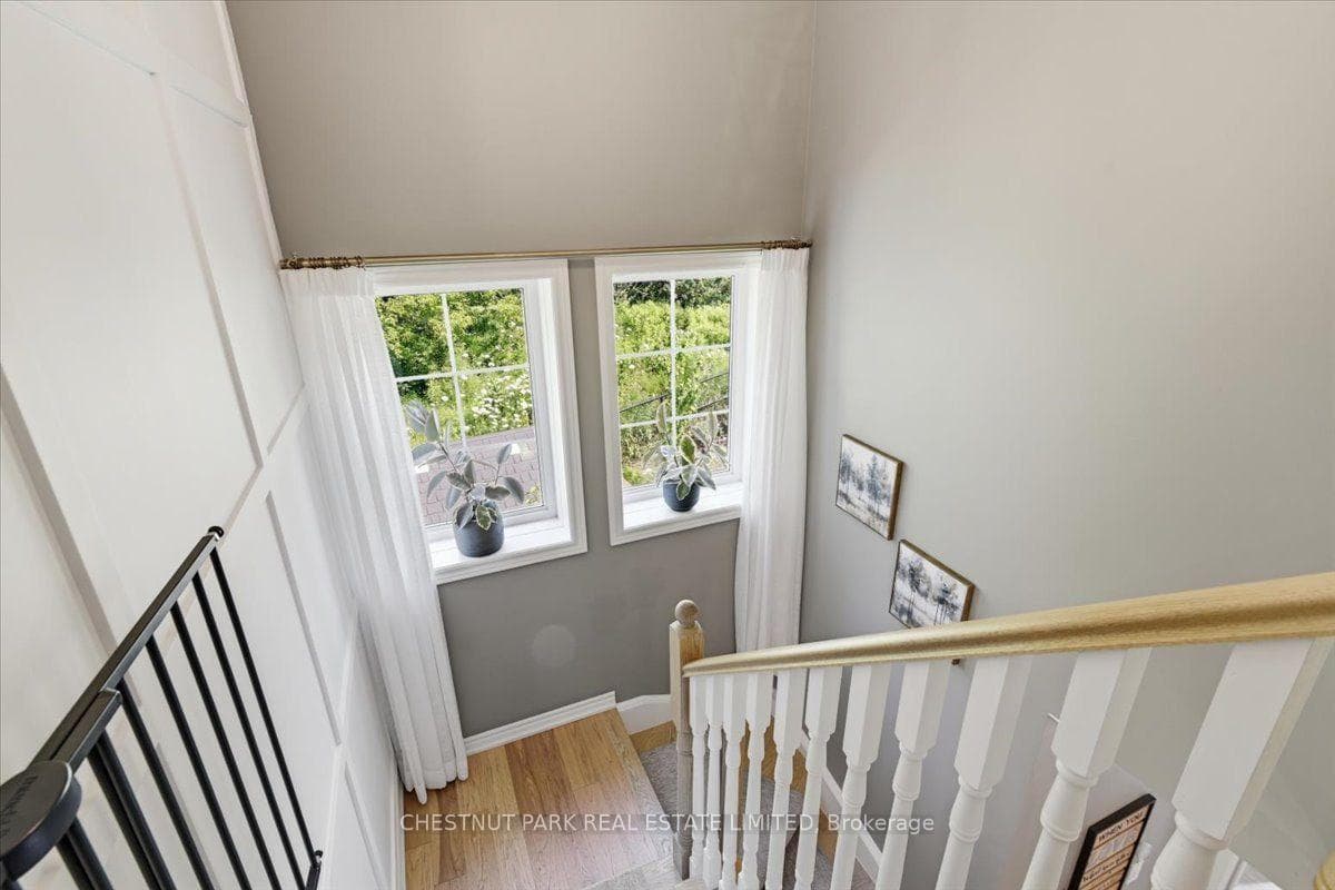 Stairway with Custom Millwork & Bright Windows