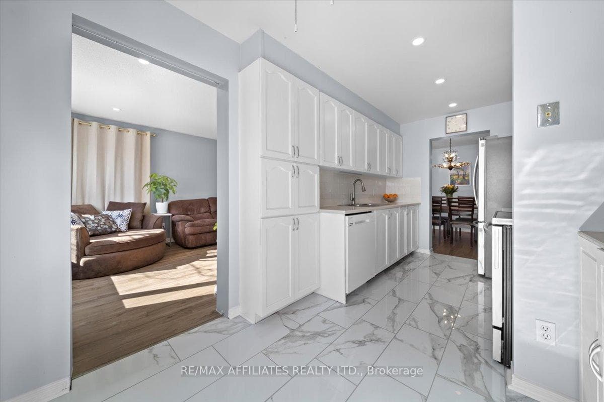 Opens to the living room and dining room