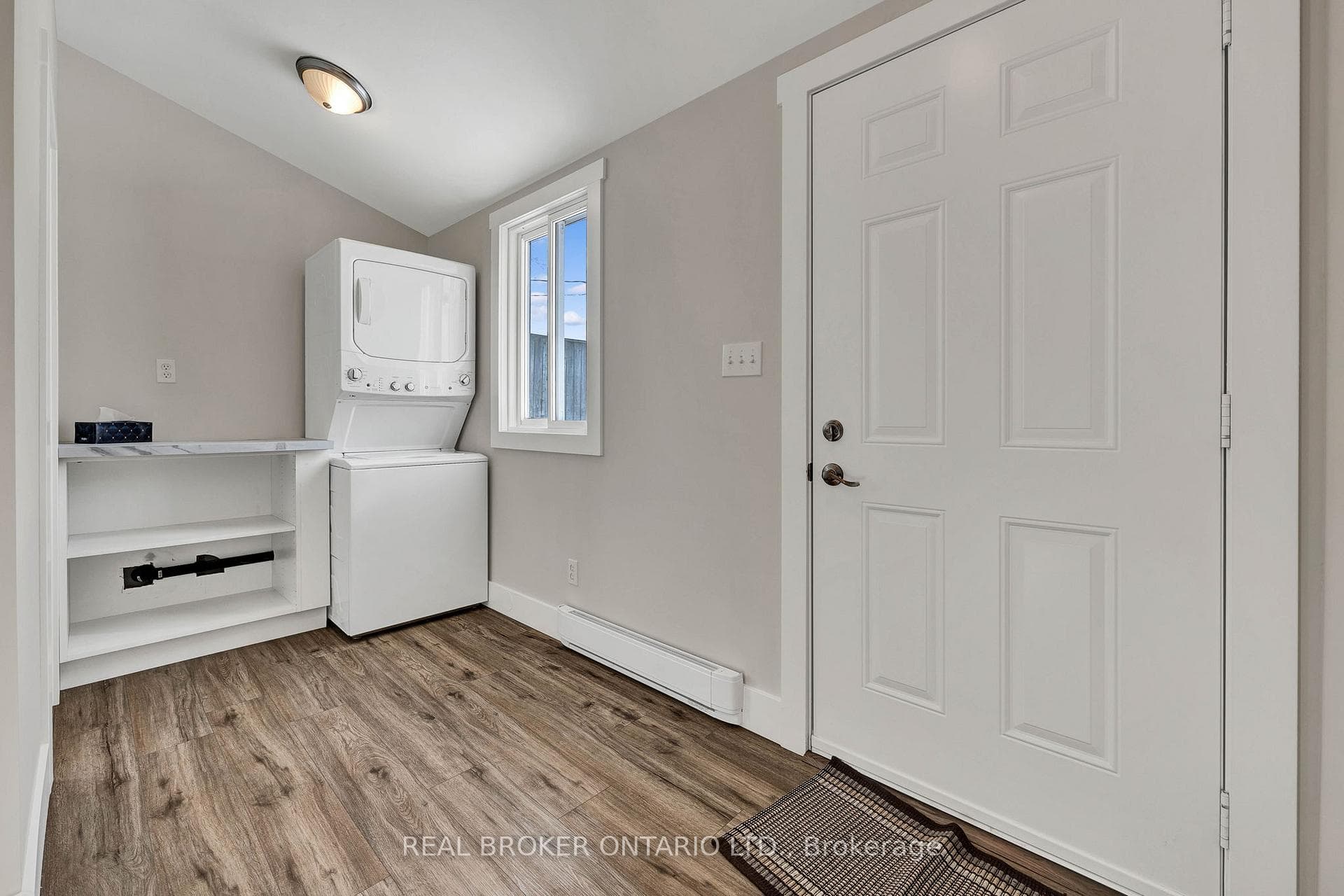 Laundry area with stacked washer / drying machine
