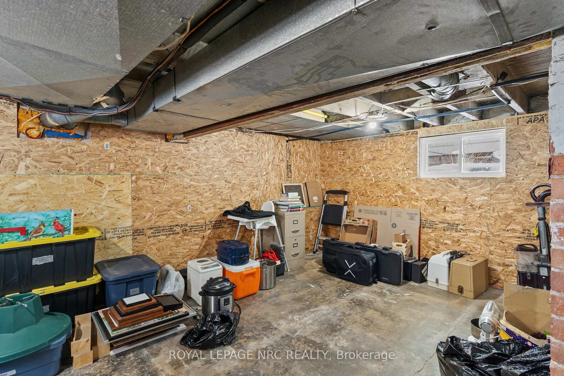 engineered wood panel covered foundation walls.