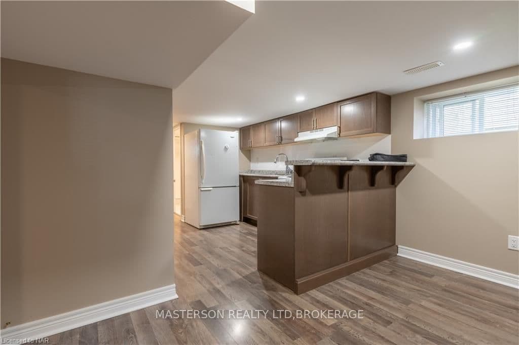 KITCHEN AND ADJACENT SITTING/TV ROOM