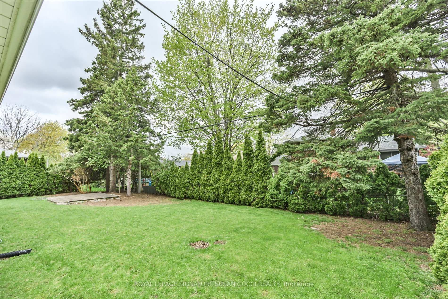 Private tree lined backyard
