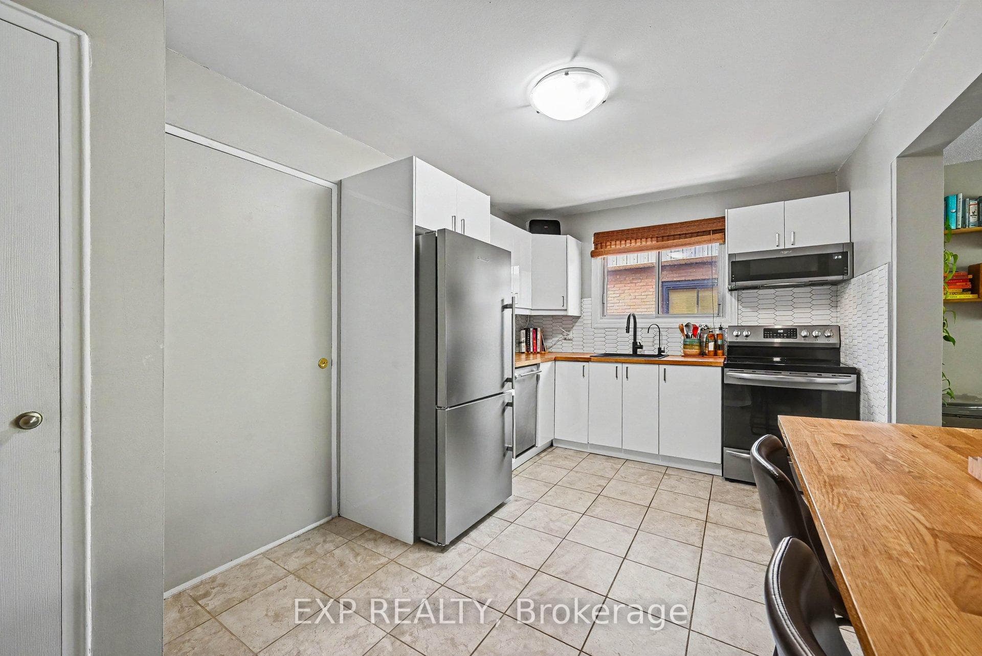 Kitchen with access to building rear entrance.