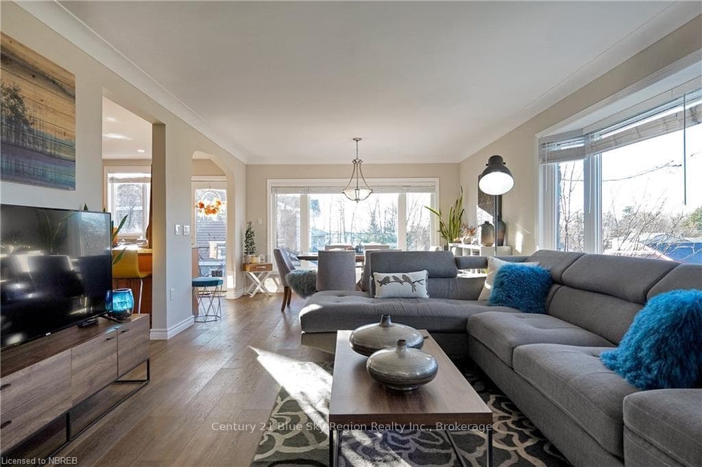 Living room with hardwood / wood-style flooring