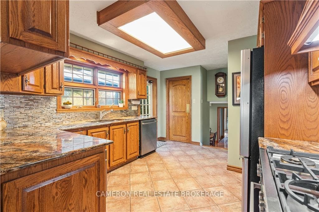 Custom built kitchen with a generous amount of woo