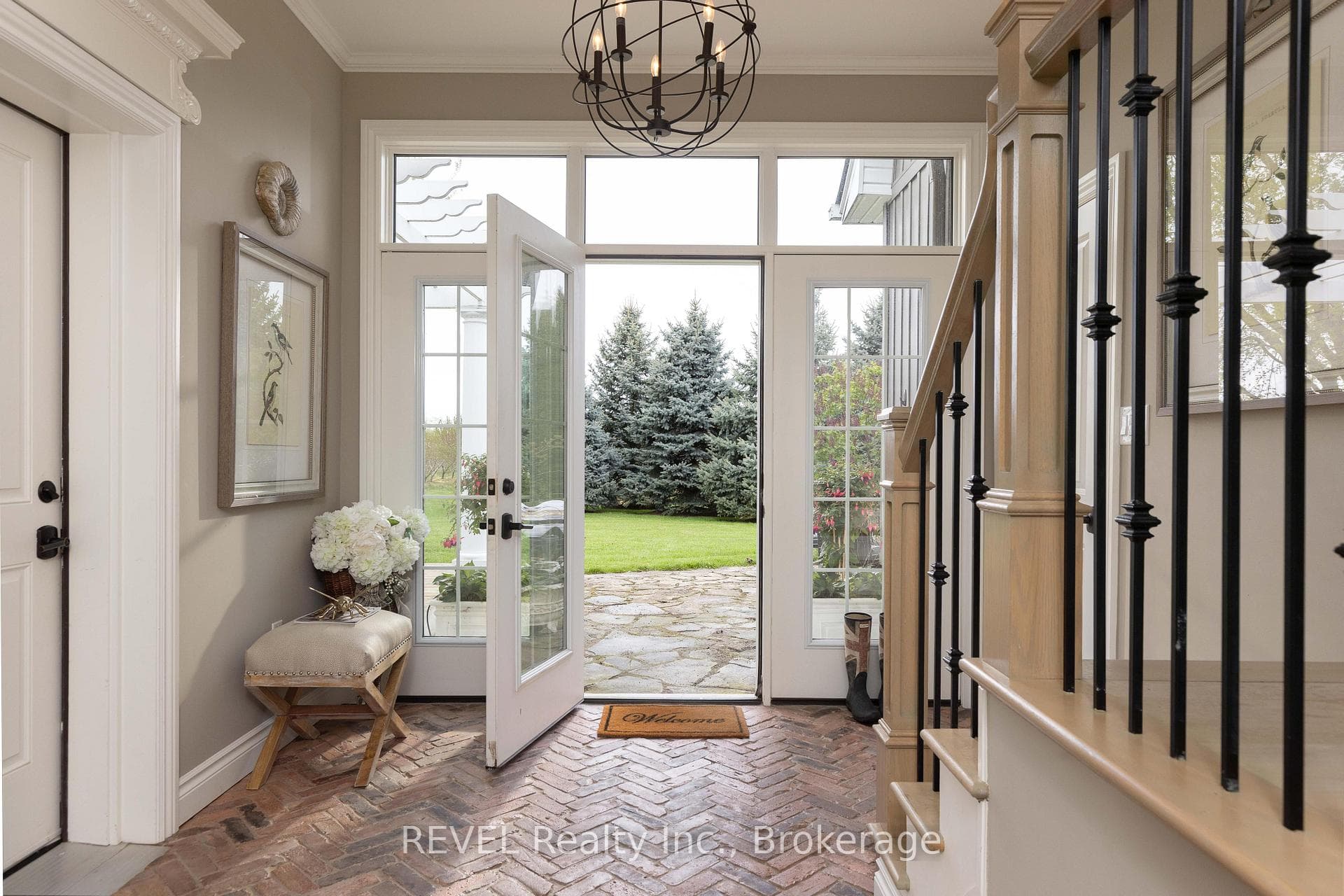Foyer with Reclaimed brick in herringbone pattern.