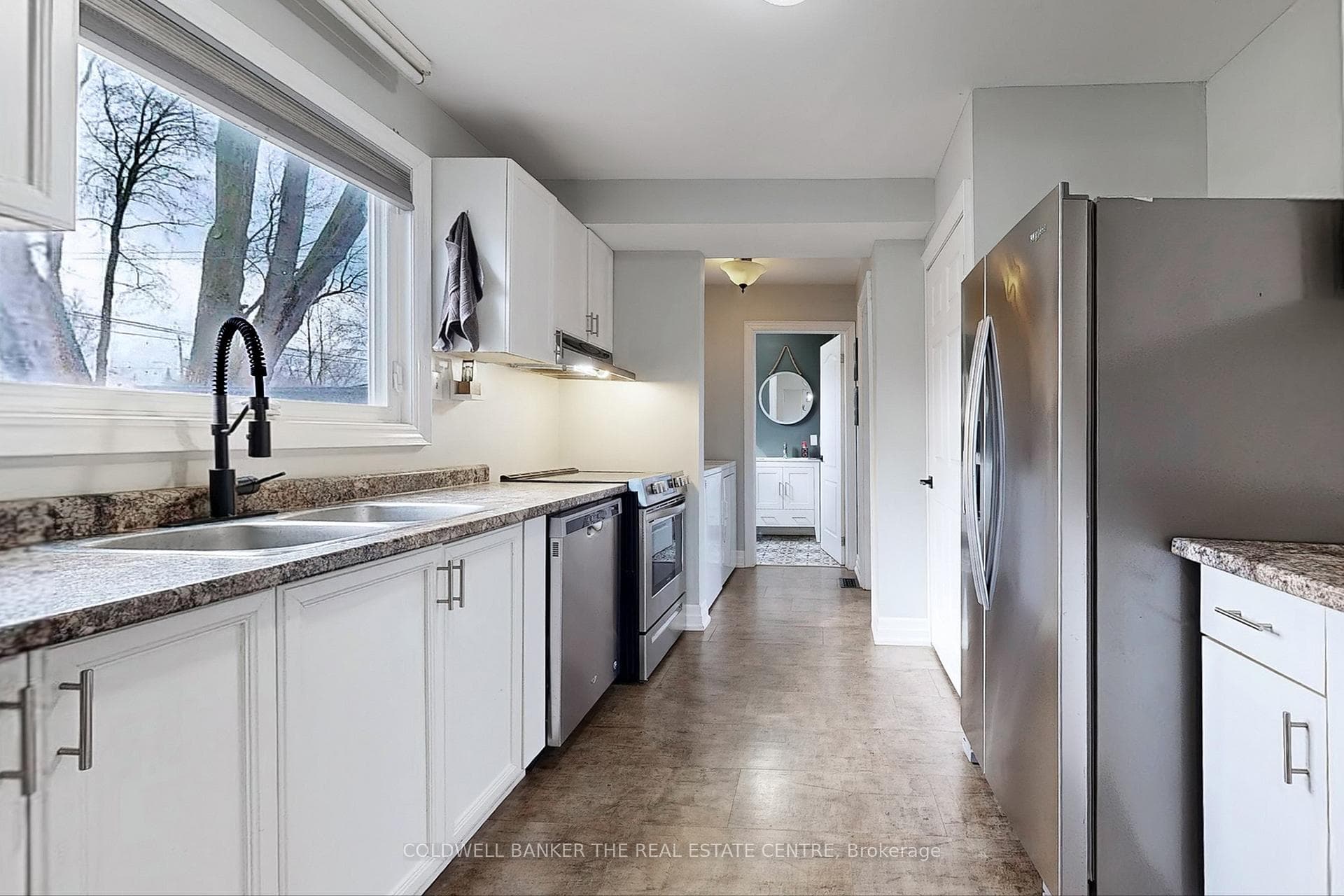 Galley style Kitchen with a huge backyard window