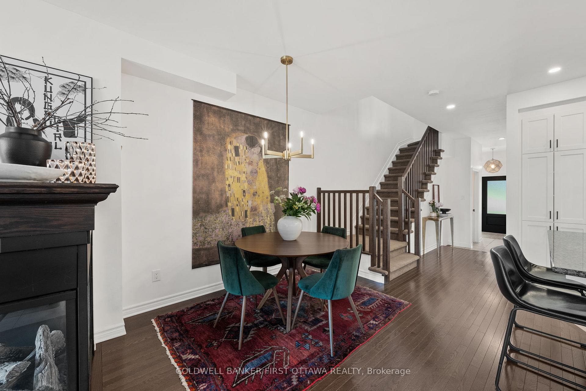 Dining room w hanging chandelier.