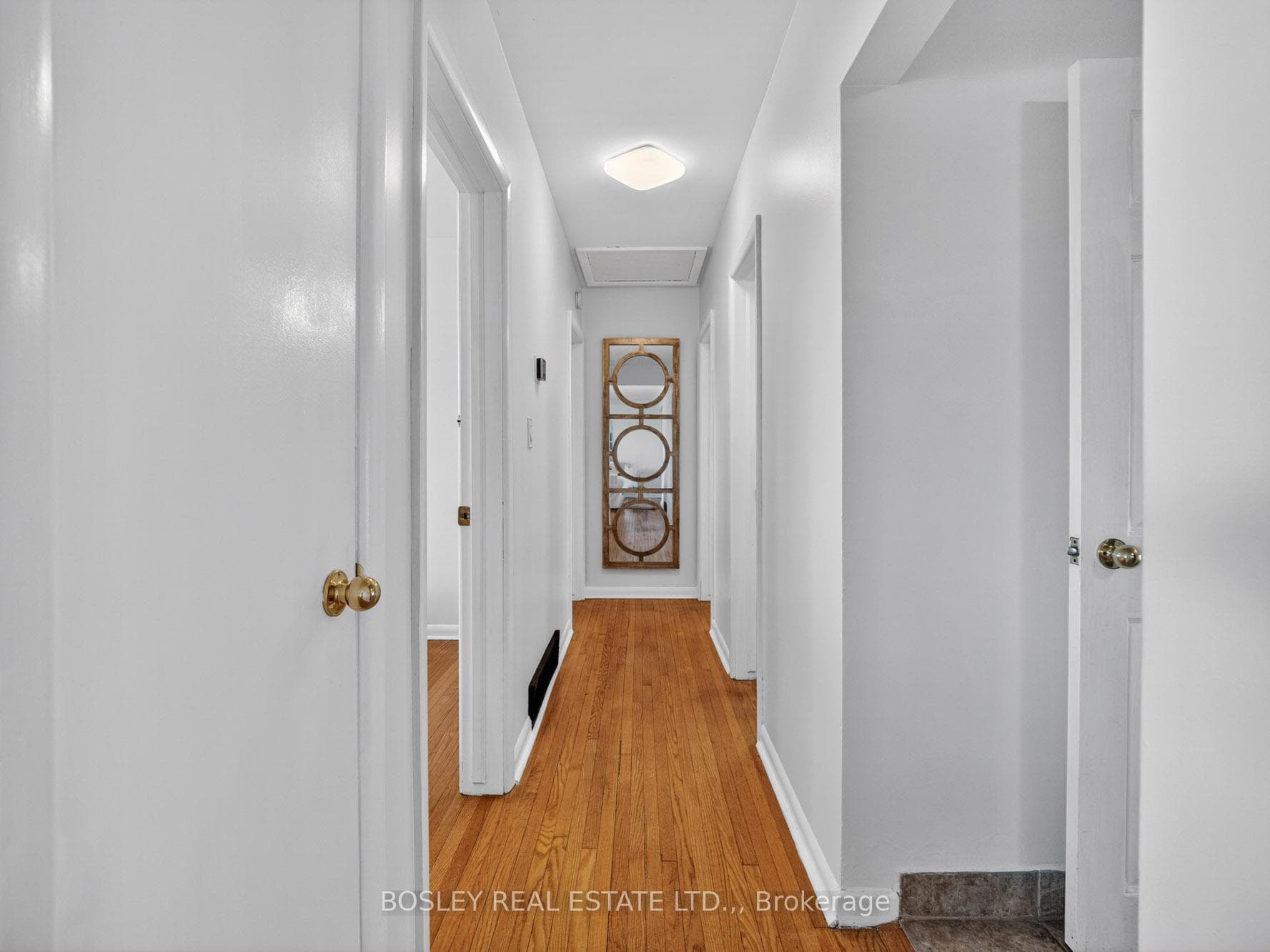 Hall leading to 3 bedrooms and a full bathroom