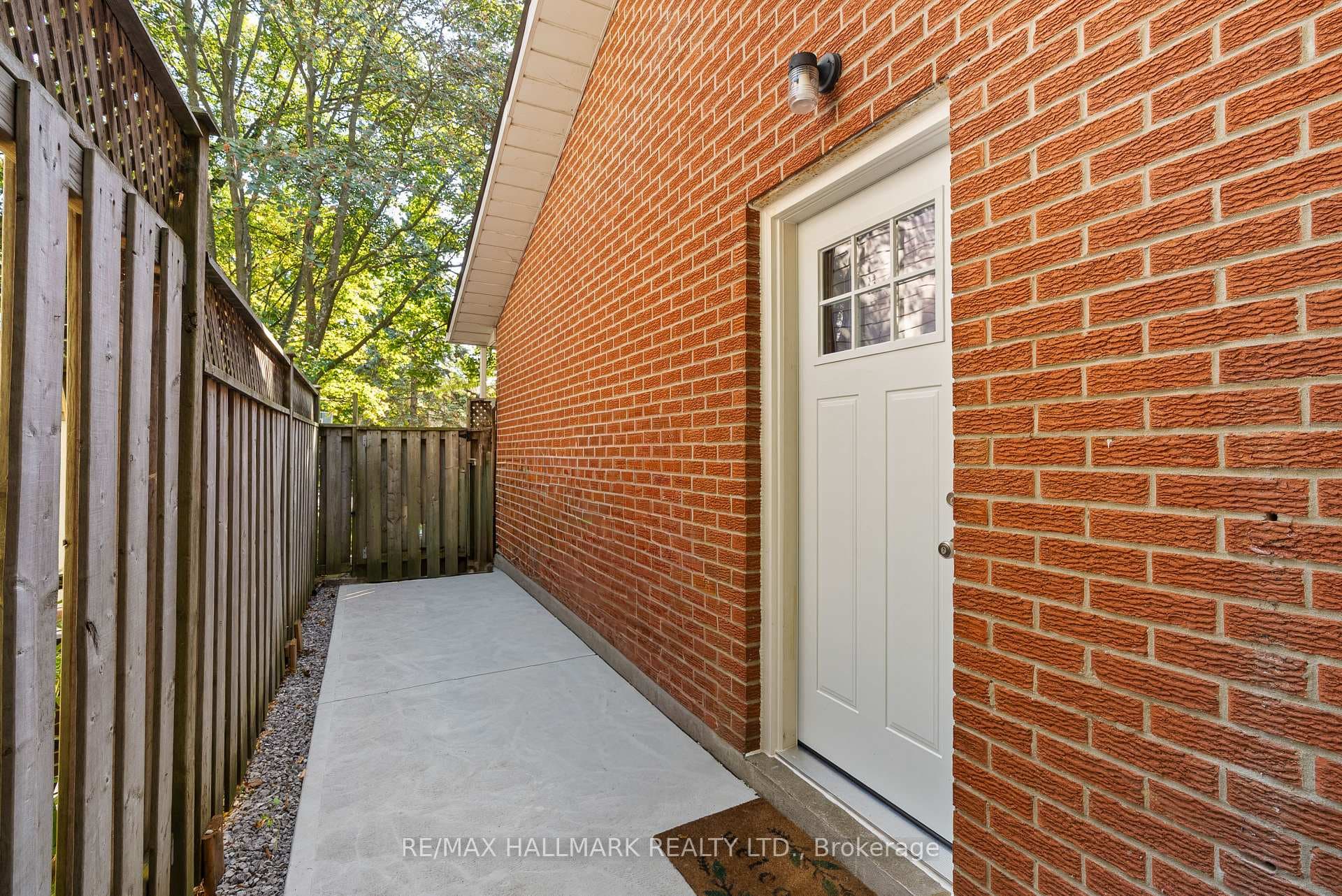 New side door '25 & concrete walkway fully fenced