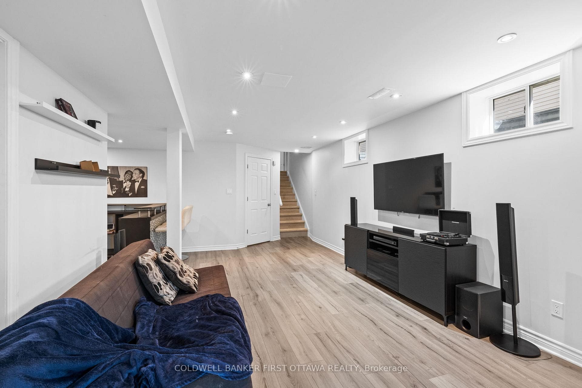 LVP flooring & pot lights above.