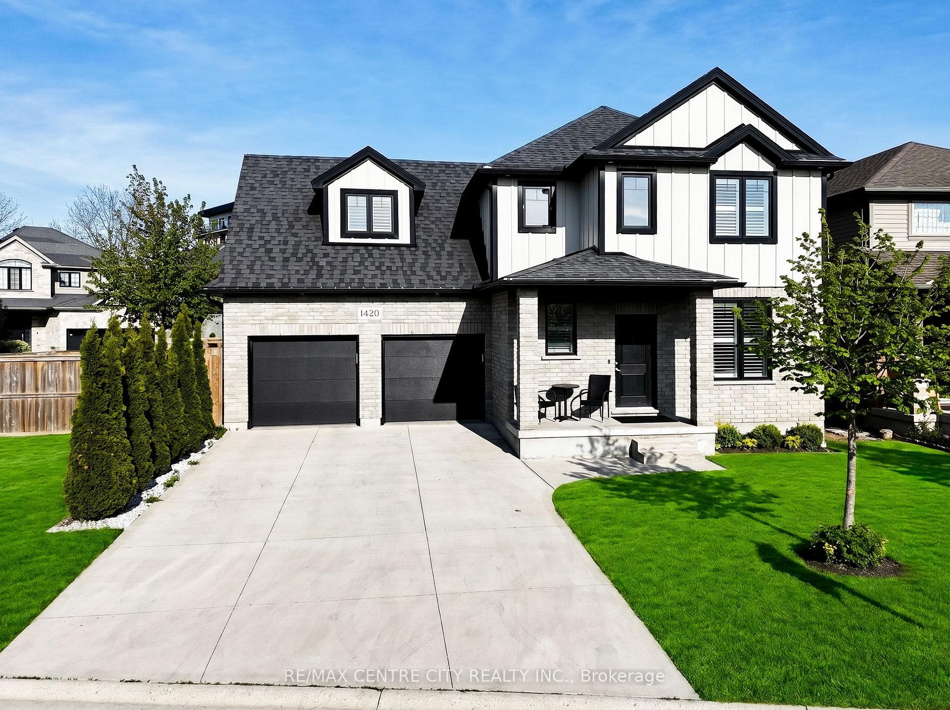Extra wide concrete driveway, no sidewalk