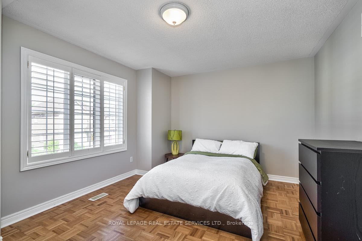 Second Bedroom with Parquet Hardwood Flooring