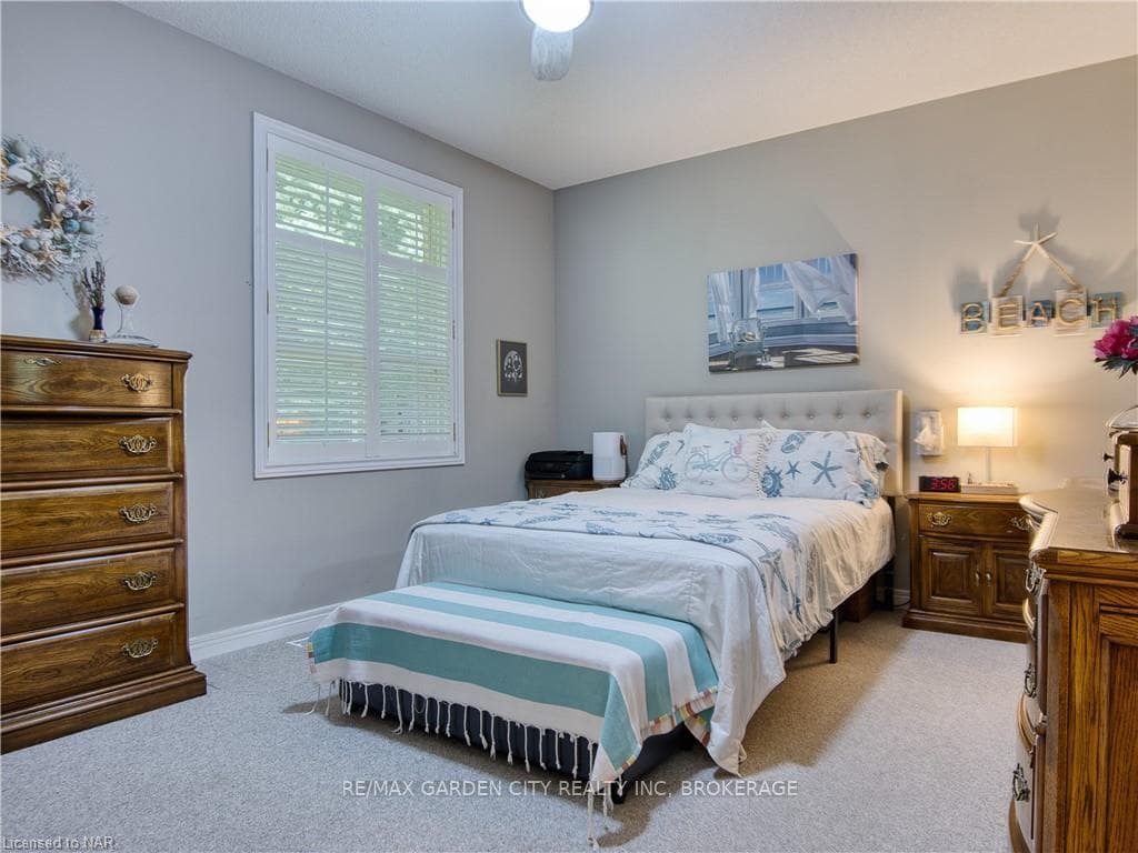 Primary bedroom features walk-in closet and privat