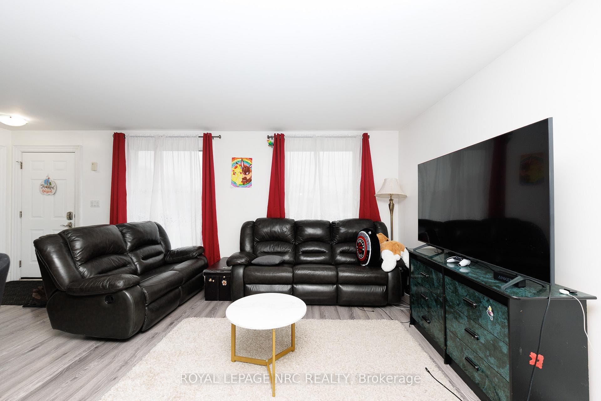 Attractive laminate flooring throughout.