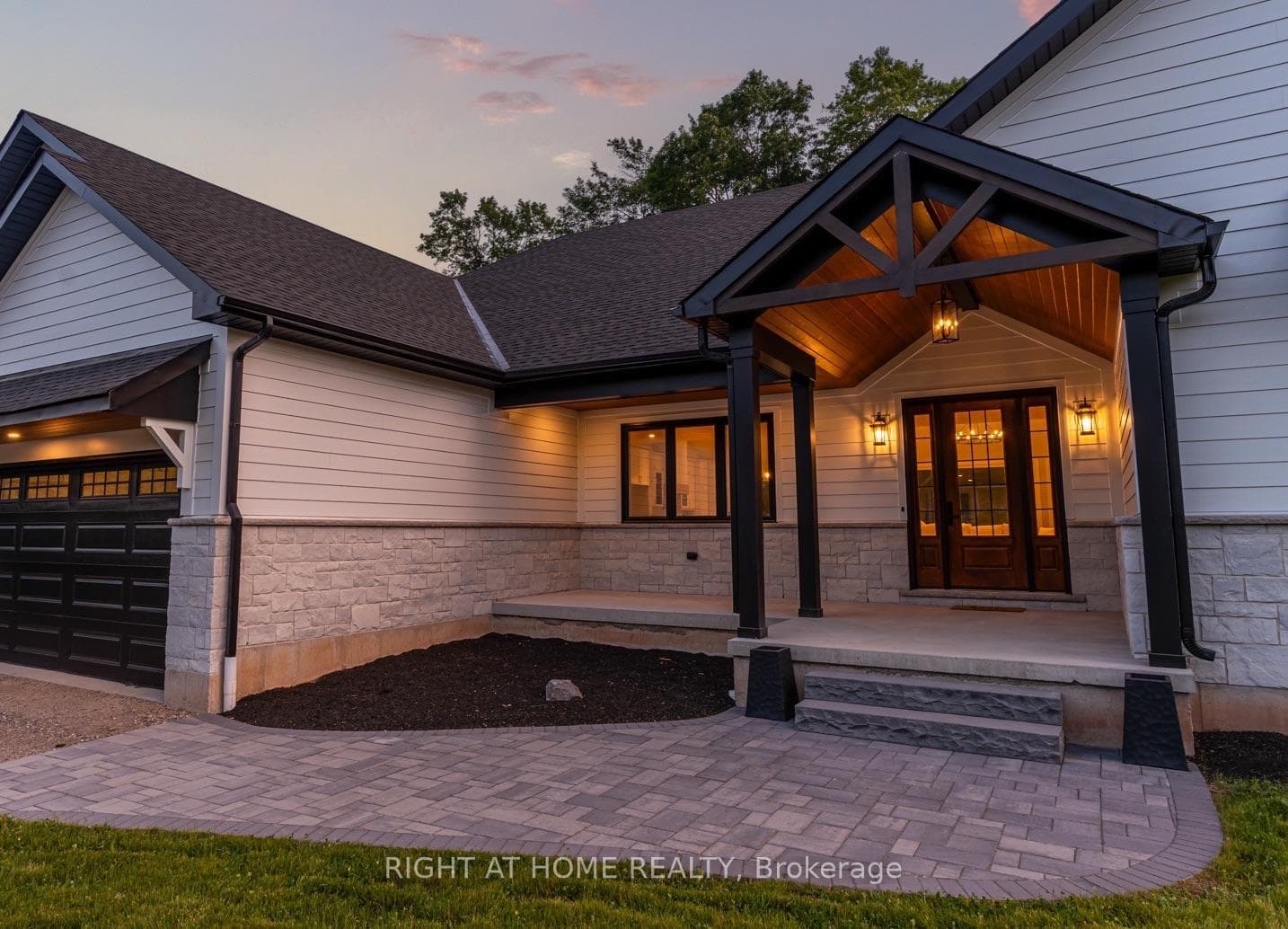 Vaulted Porch with Chandelier and Interlock Path