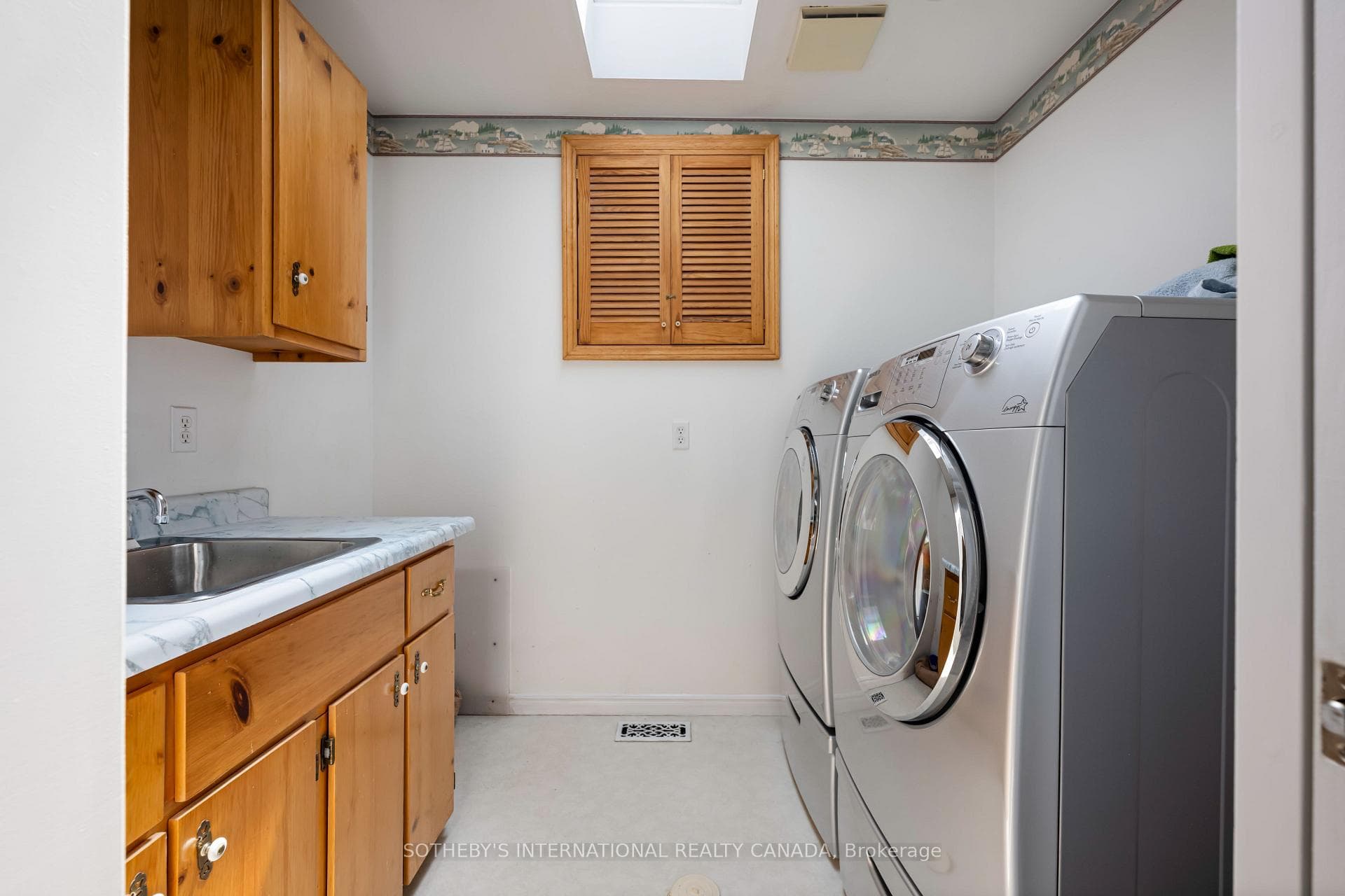 2 nd floor laundry w/skylight & sink