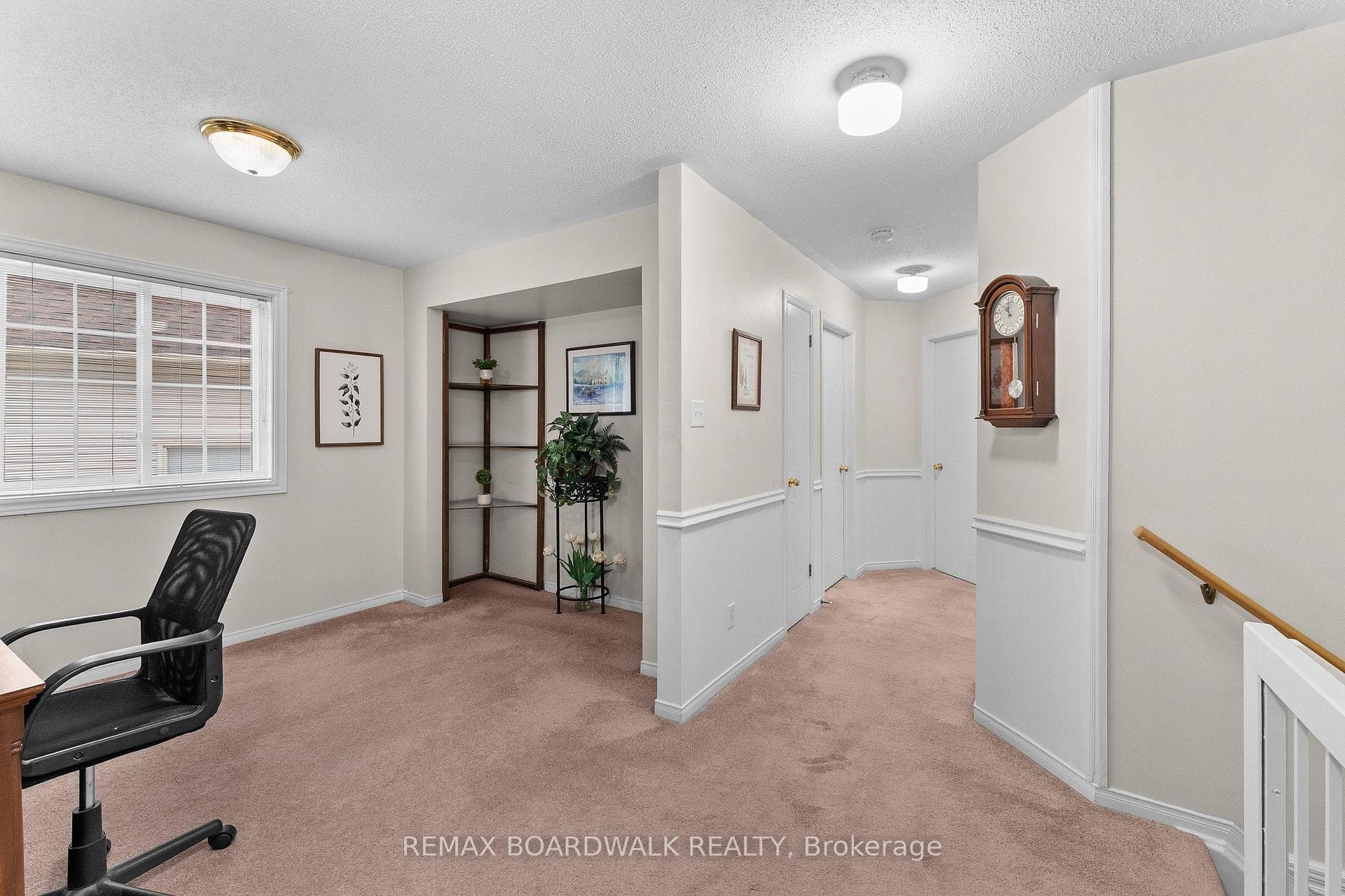Loft at top of stairs w/large window & closet area
