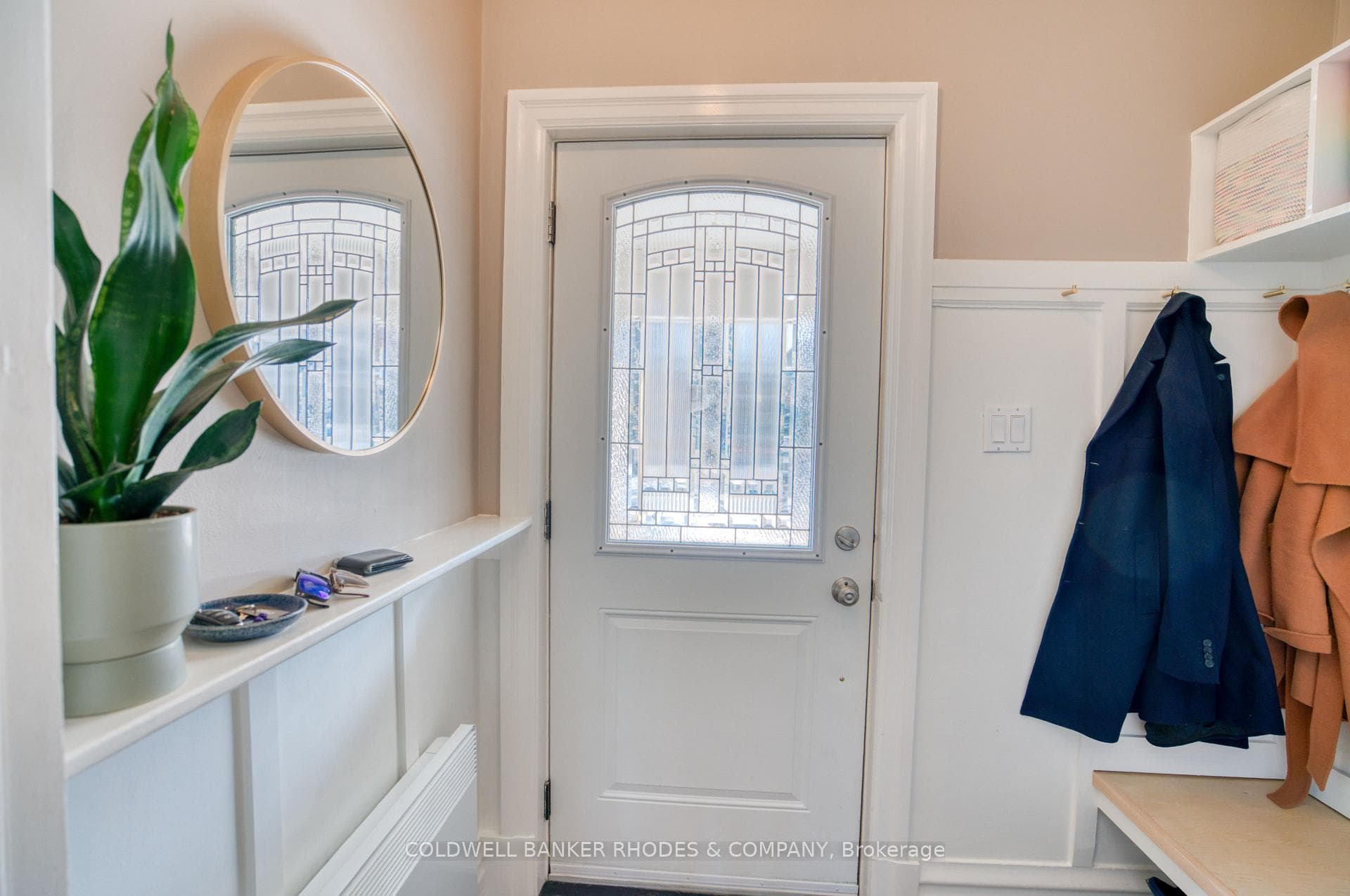 Beautiful foyer with custom wall mouldings