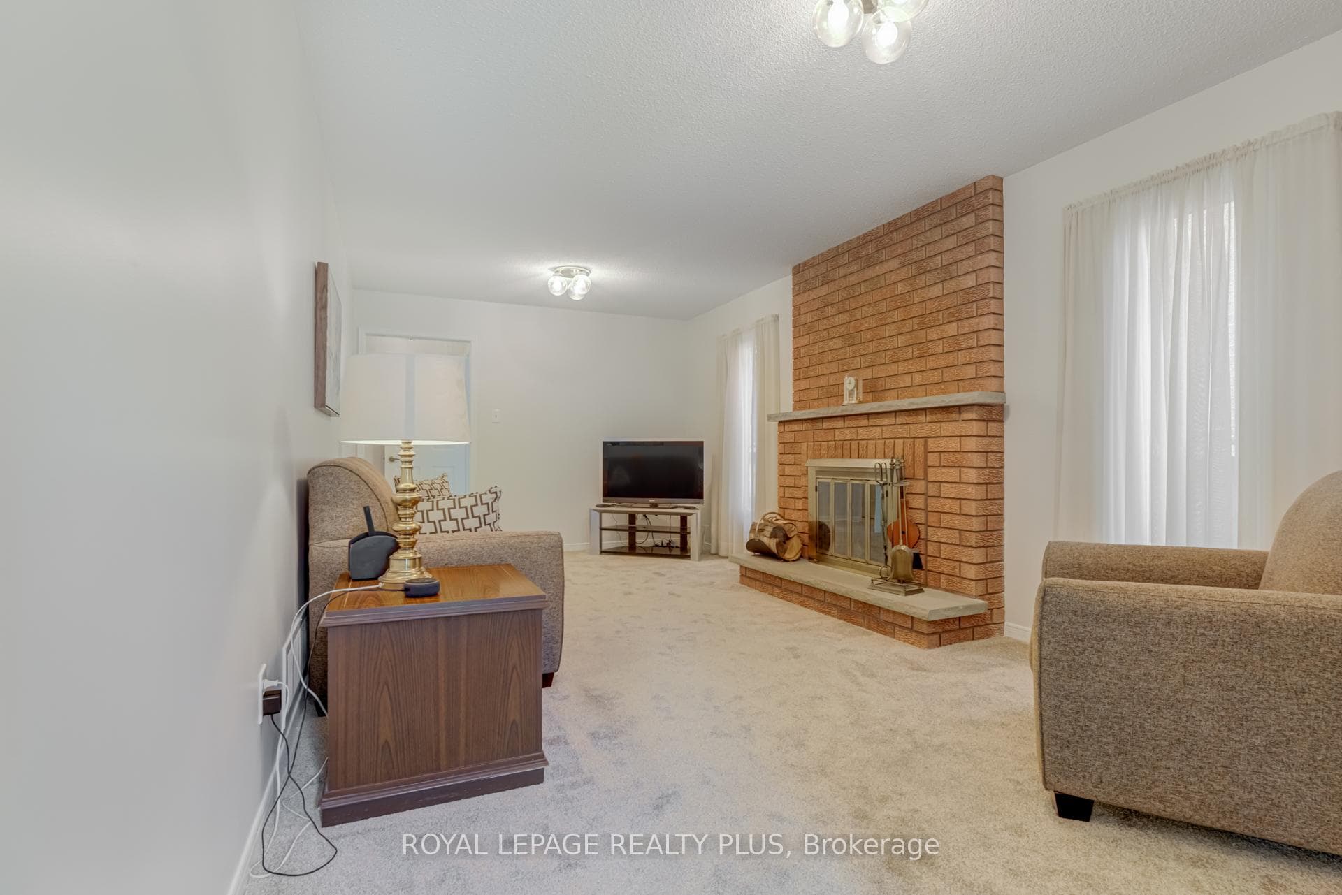 Family room with wood burning fireplace
