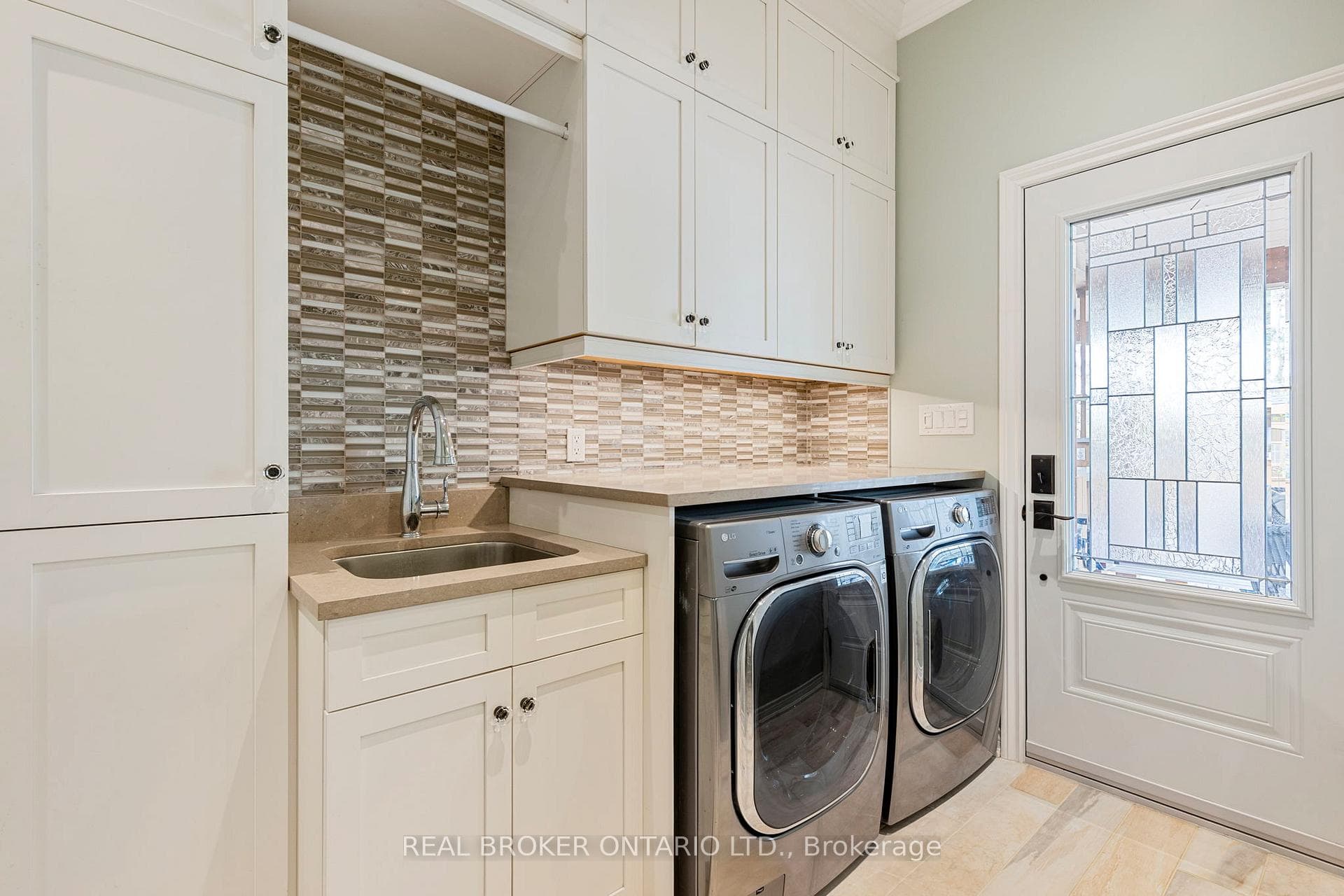Laundry Room with 2 Pc Bathroom & Garage Access