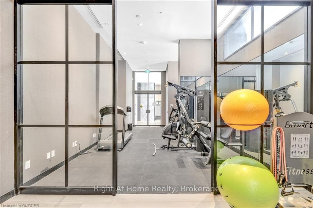 Workout area featuring expansive windows and a wea