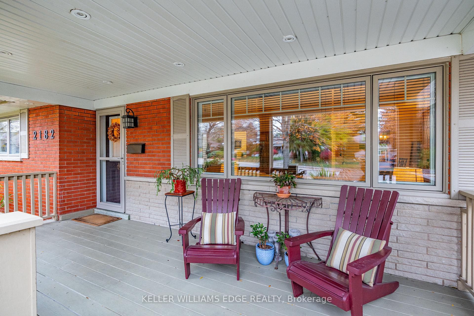 Large covered front porch with potlights